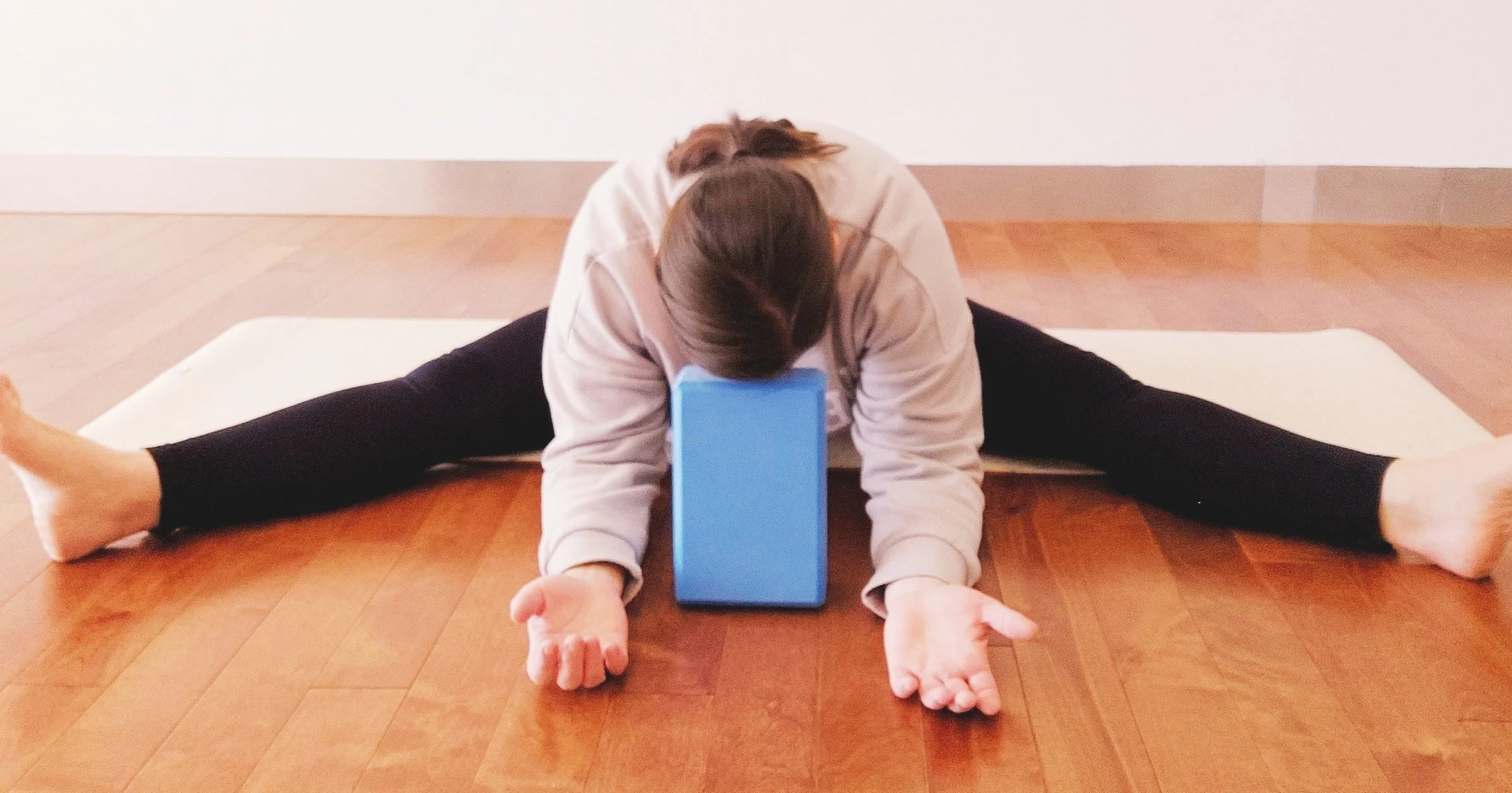 Yoga-Pose-Seated-Straddle-Forward-Fold-Block-Under-Head