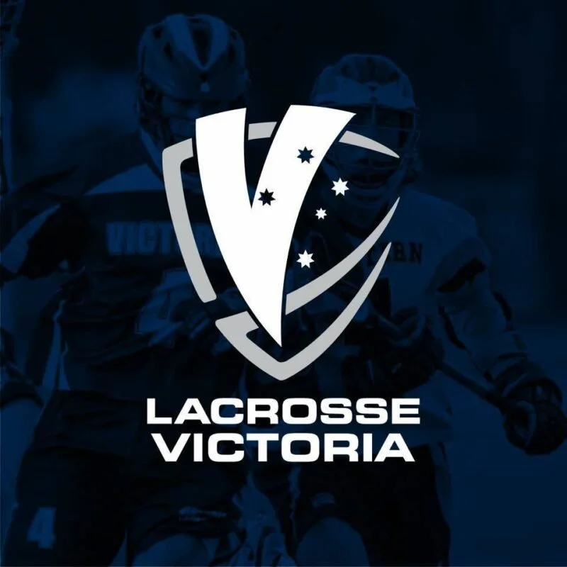 Navy square background, grey icon of a lacrosse goalkeepers mask with a white V over the top