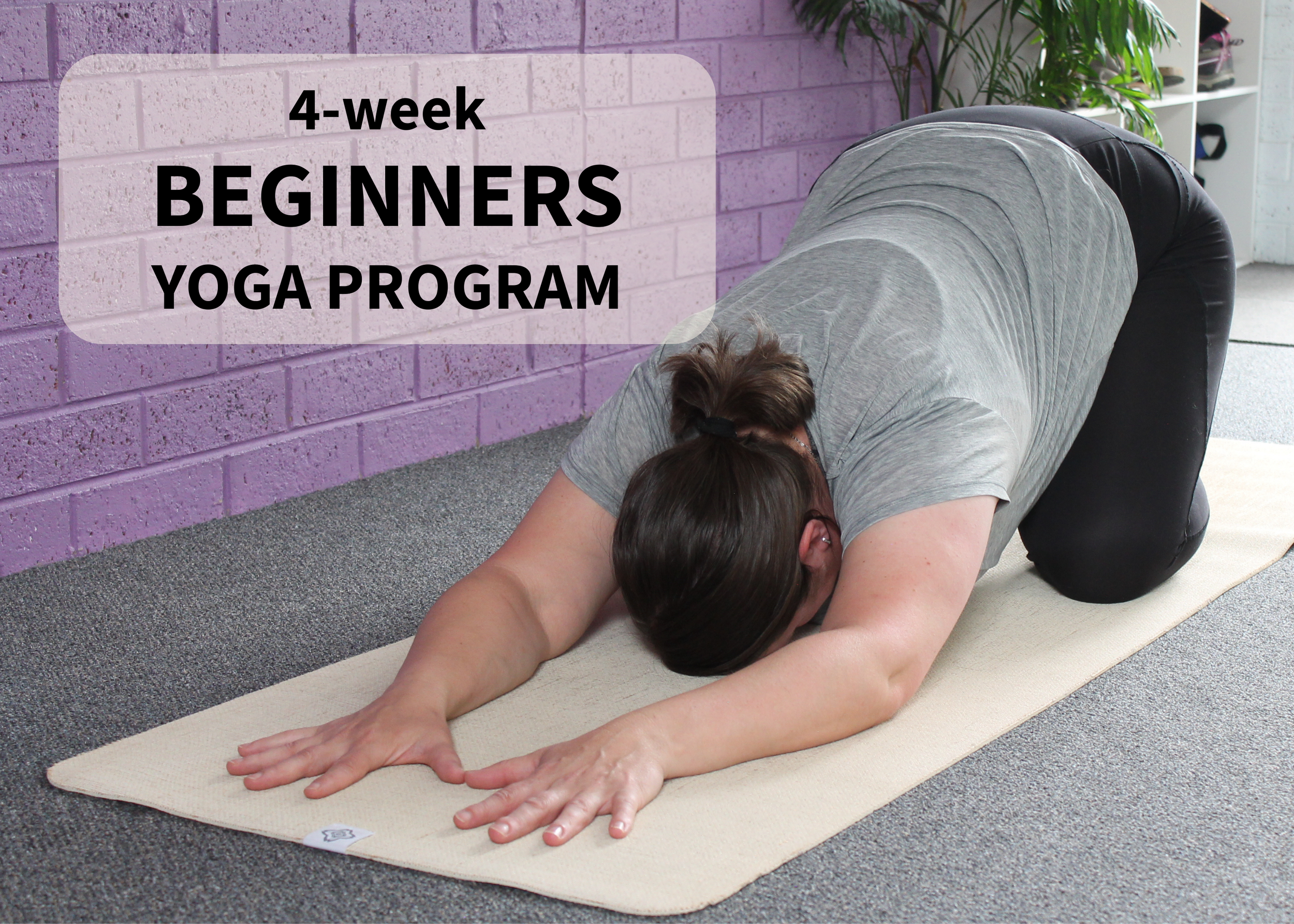 Yoga-Childs-Pose-Arms-Extended-Head-Down-Purple-Brick-Wall