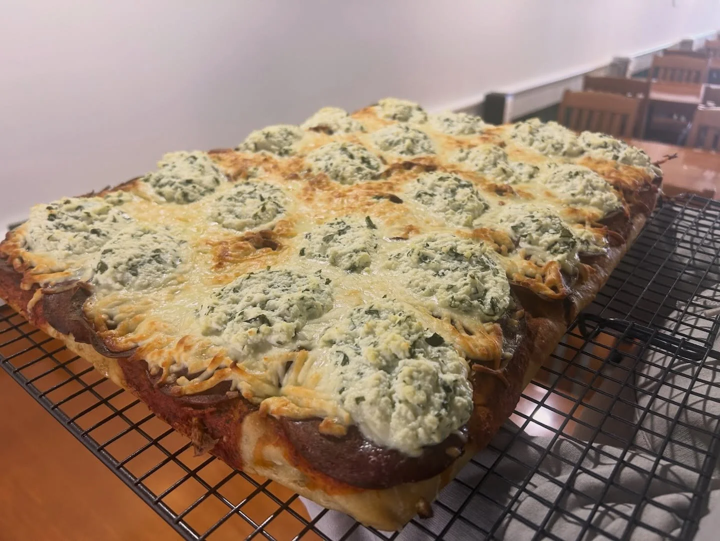 Holy Sheet! 
Thats a beauty sheet of Foccacia pizza! 
It&rsquo;s a pepperoni pizza, mozzarella cheese with a tomato basil base. Topped off with basil ricotta cheese and house hot pepper fermented local honey, served with garlic aioli to dunk and dip.