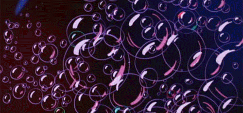 Numerous purple and pink bubbles floating against a dark background.