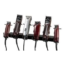 Six wireless microphone body packs mounted on a stand.