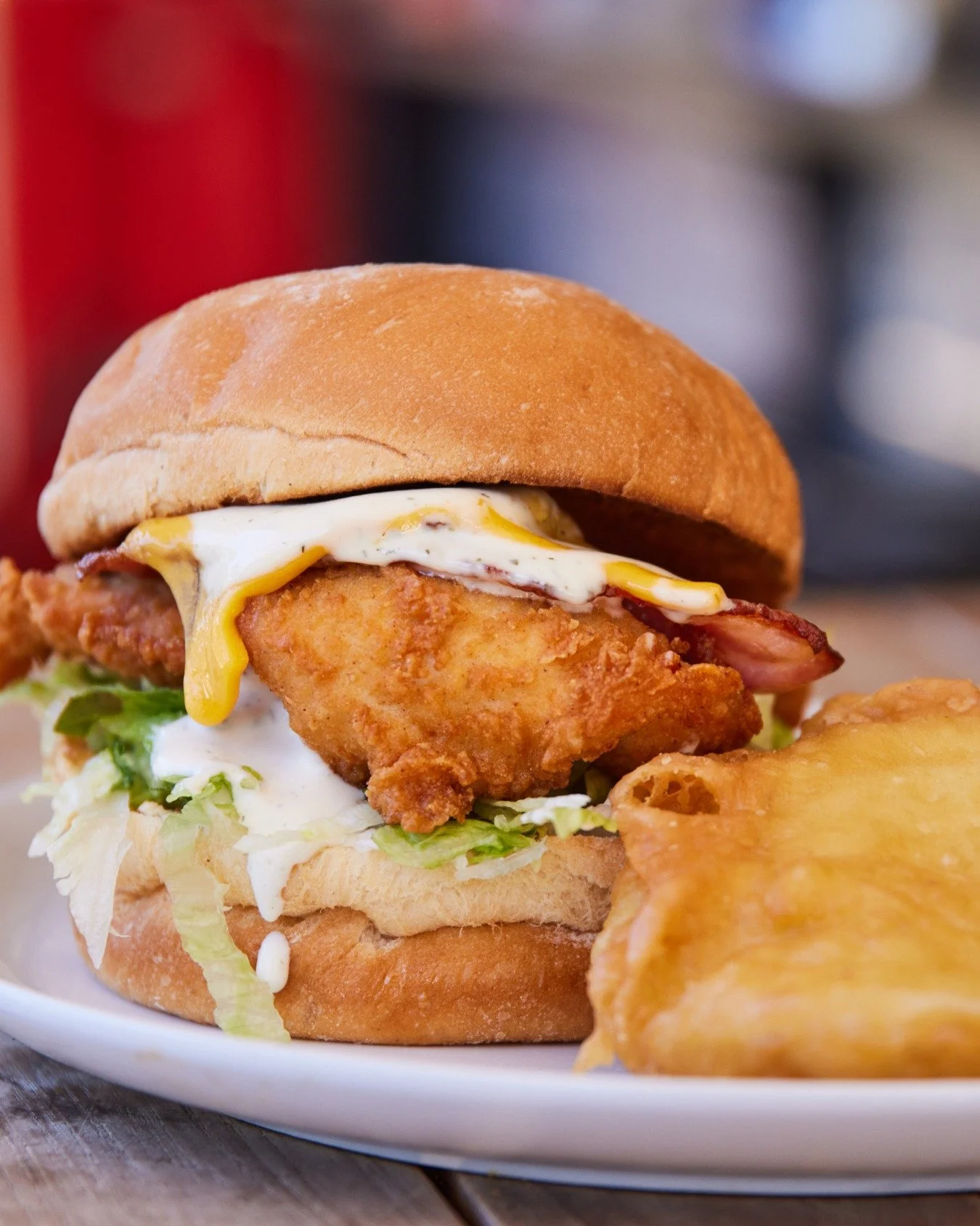 Crispy, cheesy, bacon-y&hellip; and yes, ranch is mandatory. 😋🍔 Served with golden potato scallops! #ChookALicious #BurgerGoals