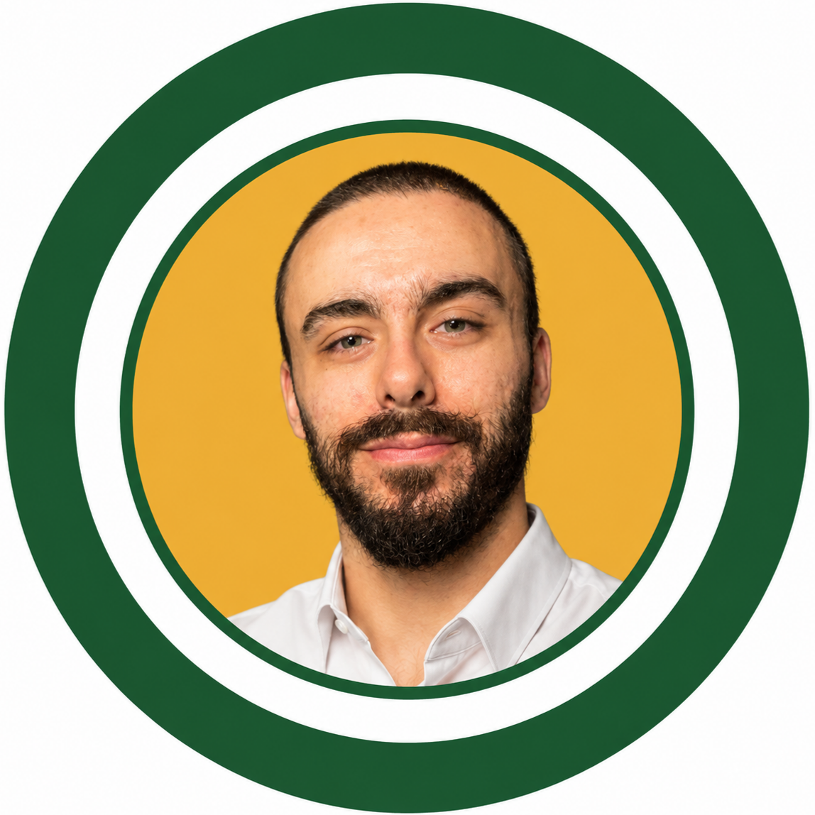 Portrait of a smiling man with dark hair and beard, wearing a white shirt and brown blazer, set against a yellow background with a dark green frame and white border.