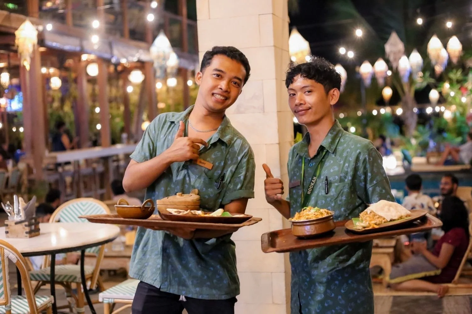 the service team ia carrying indian food for the guest