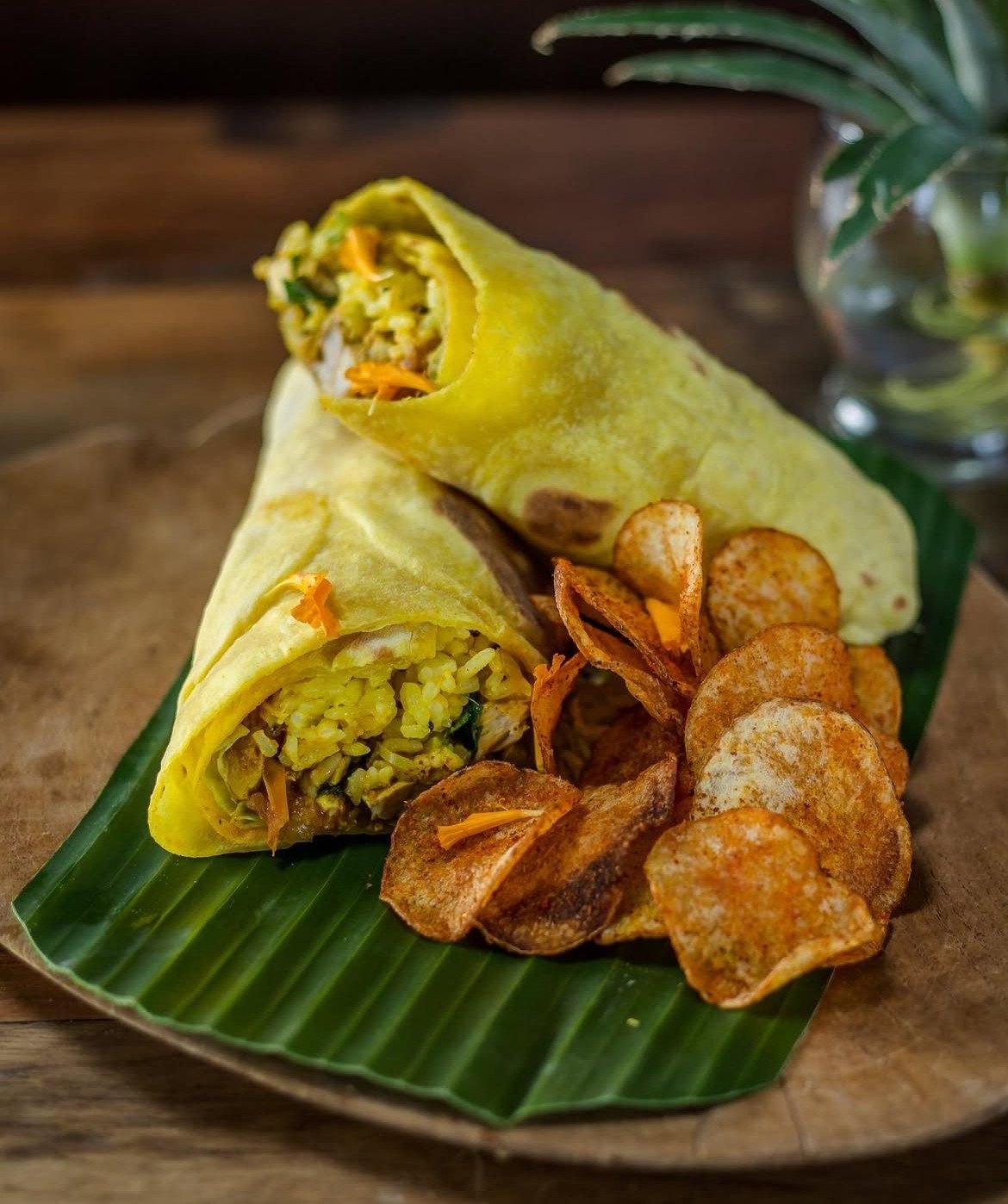 Biryani burrito filled with spiced rice and vegetables, served with crispy potato wedges at Pesona Lounge Trawangan.