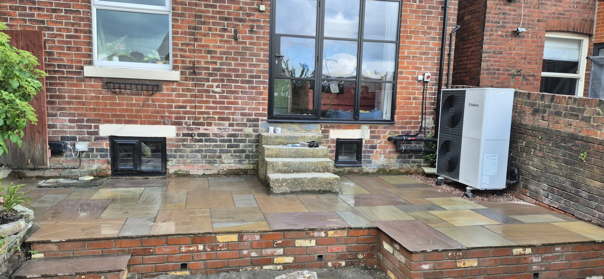 Raj Blend Indian stone paving, with reclaimed brick walling Meersbrook, Sheffield