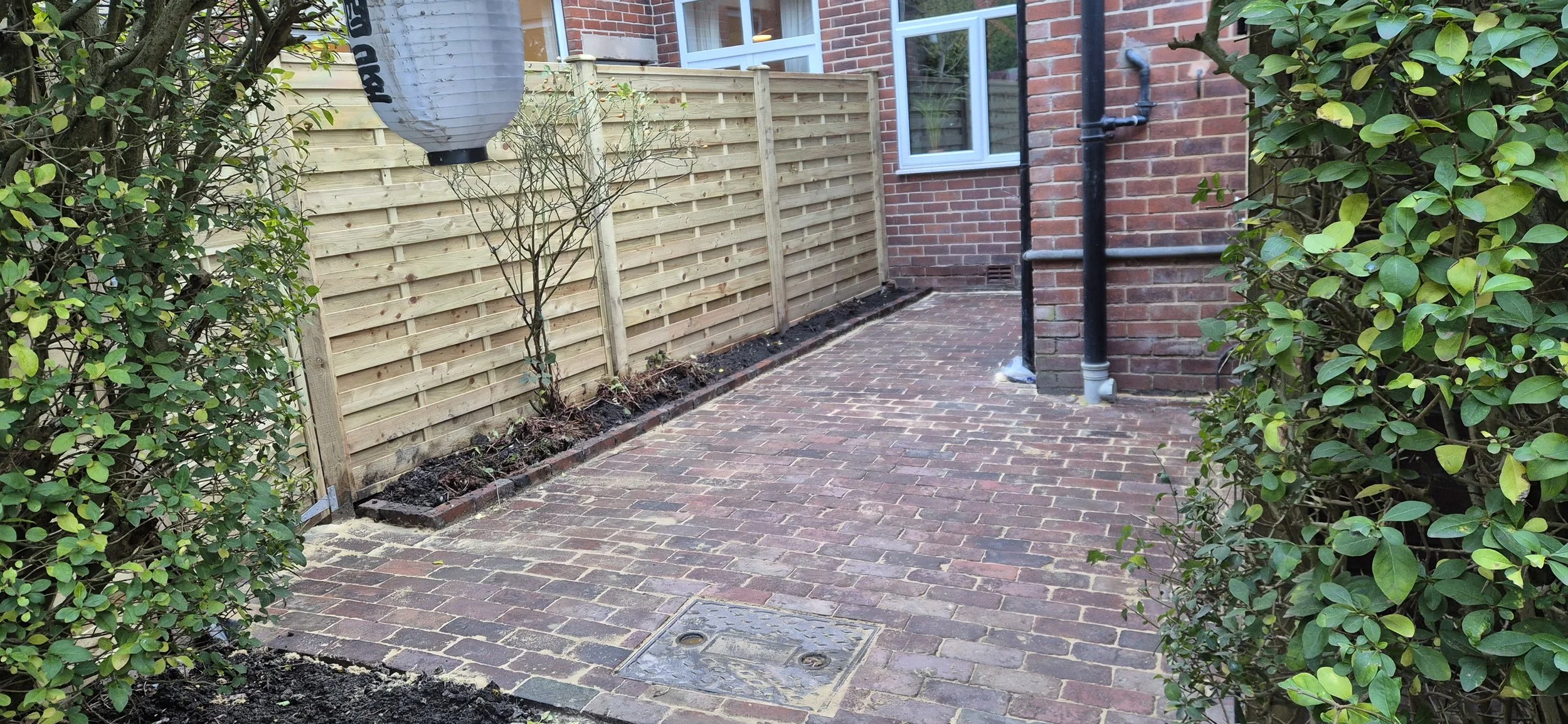 6ft square horizontal panels in 4x4 timber posts with caps