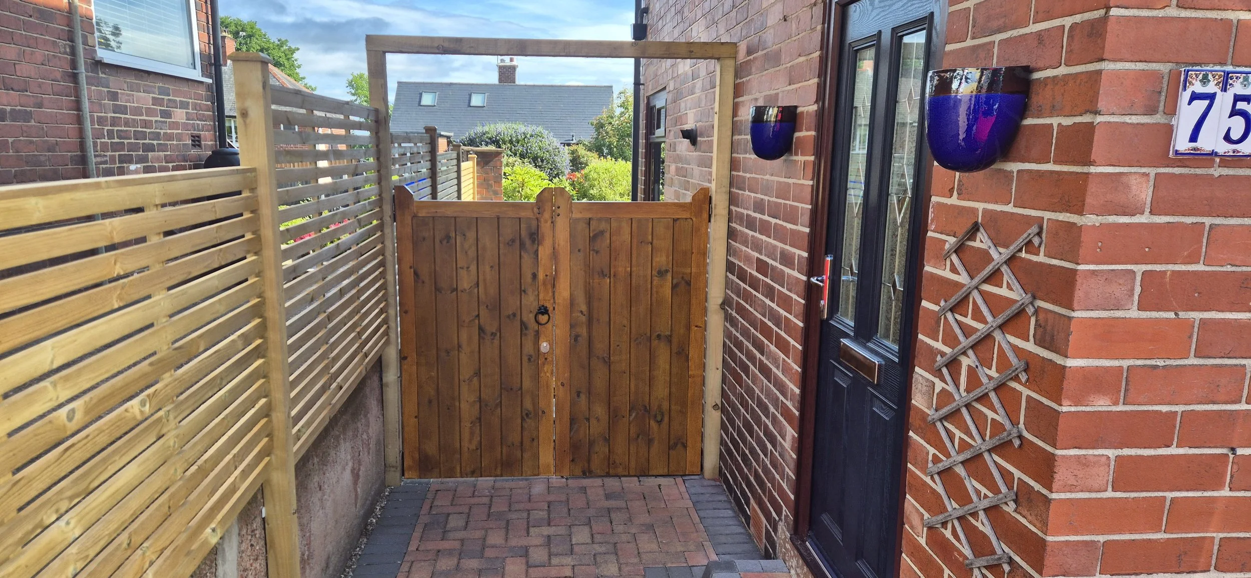 Mortise and tennon gates with gate lock  and contemporary fence panels. Norton lees, Sheffield