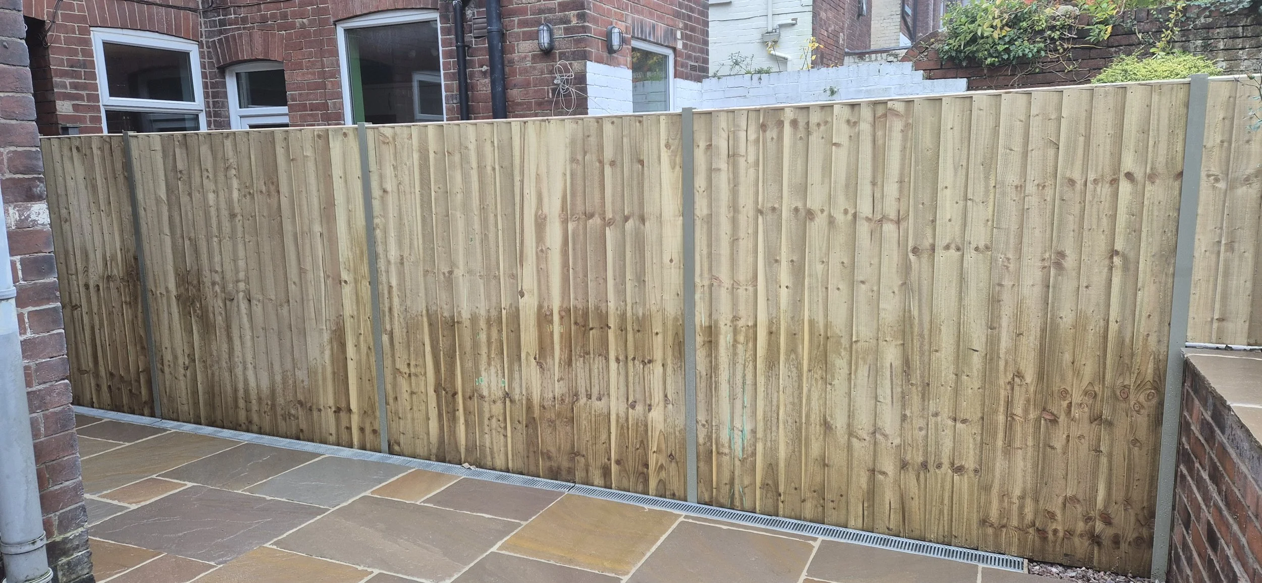 Feather edge panels in olive grey Duraposts. Hunters bar Sheffield