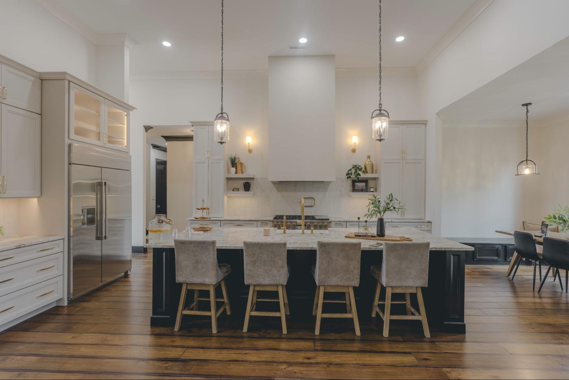 Kitchen with micro-cement range hood in Providence Haven by MDI Custom Homes.
