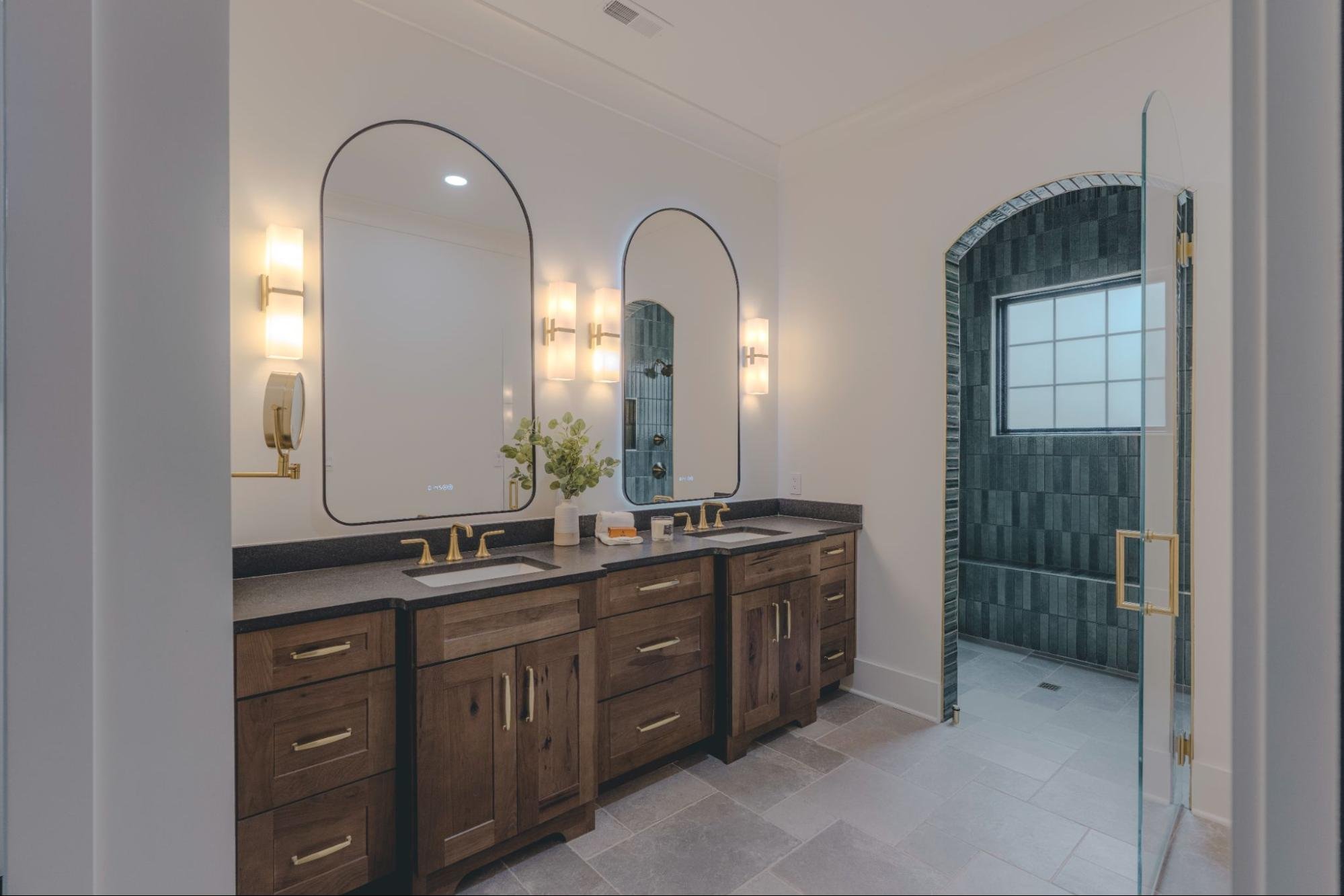Luxury primary shower with arched opening in Providence Haven, a custom home in Greenback, TN.
