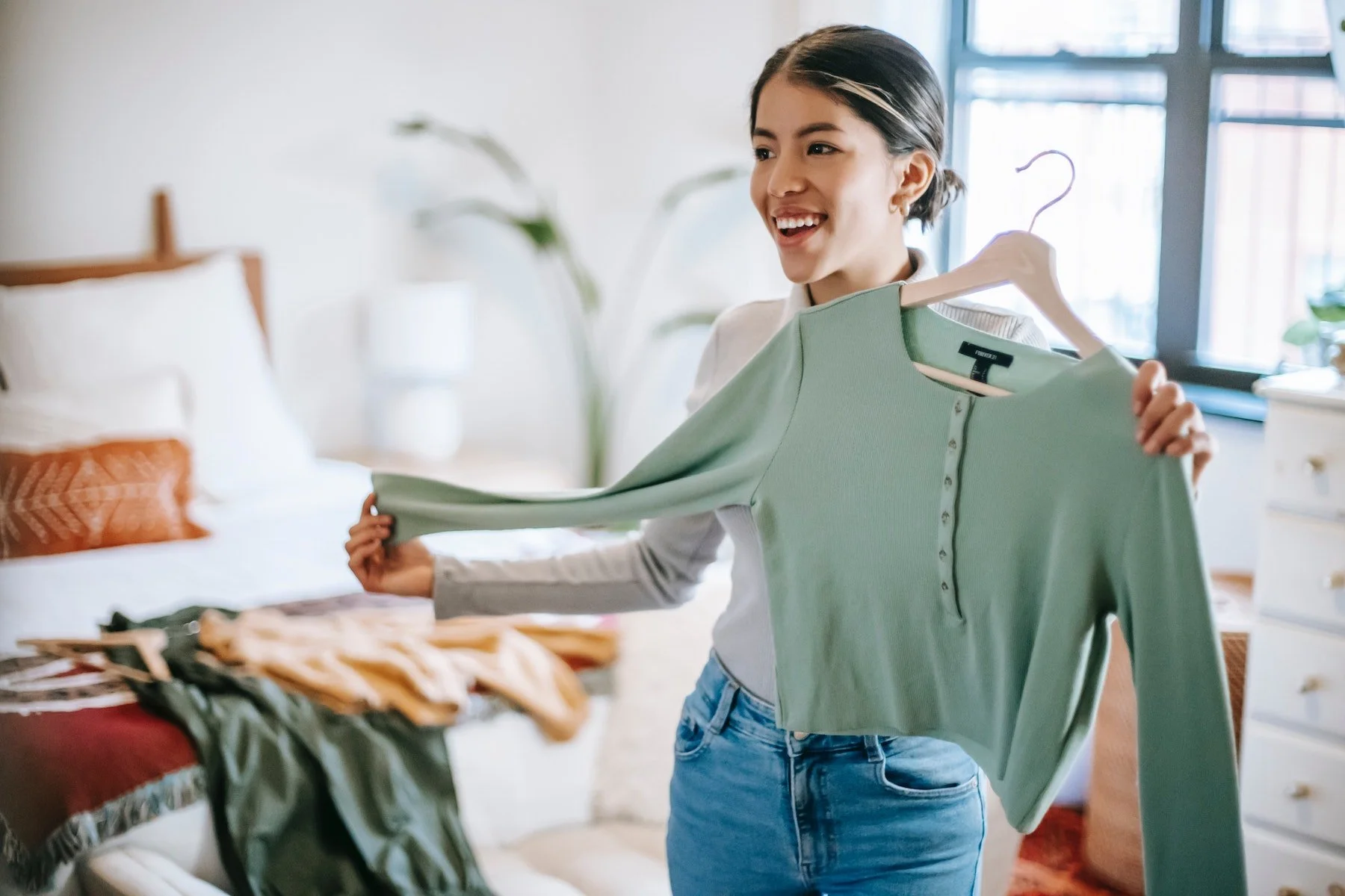 girl styling a green top