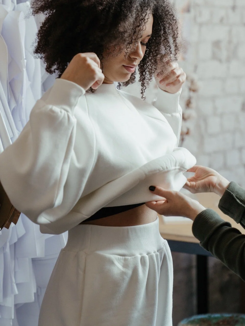 woman styling white outfit