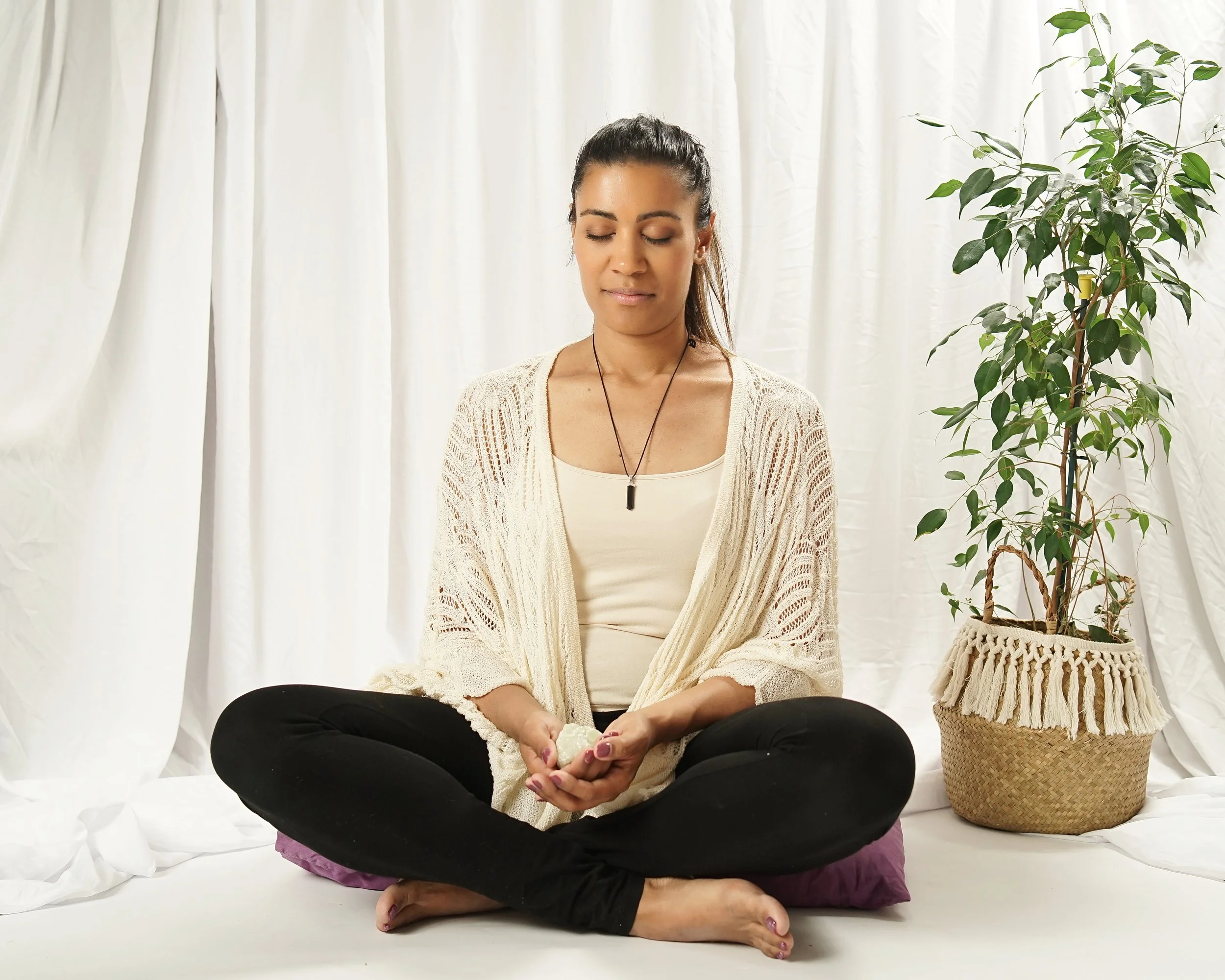 Stefanie sitting in quiet meditation before a Transformational Breath® session