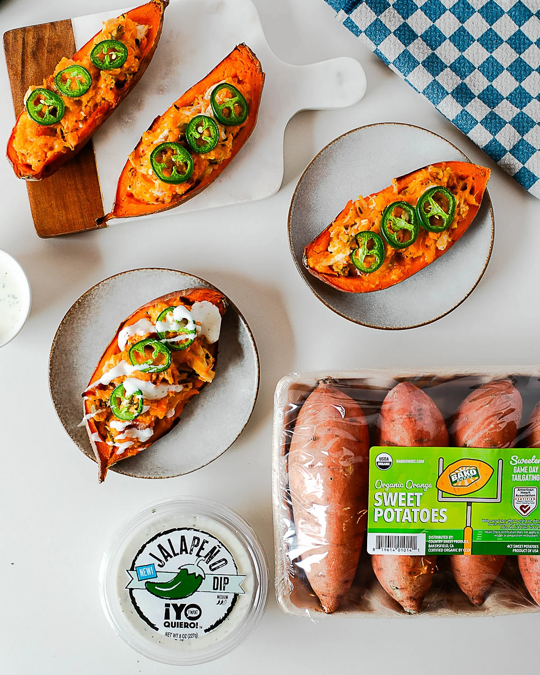 Chicken and twice-baked sweet potatoes Jalapeño Poppers next to Bako Sweet Potatoes