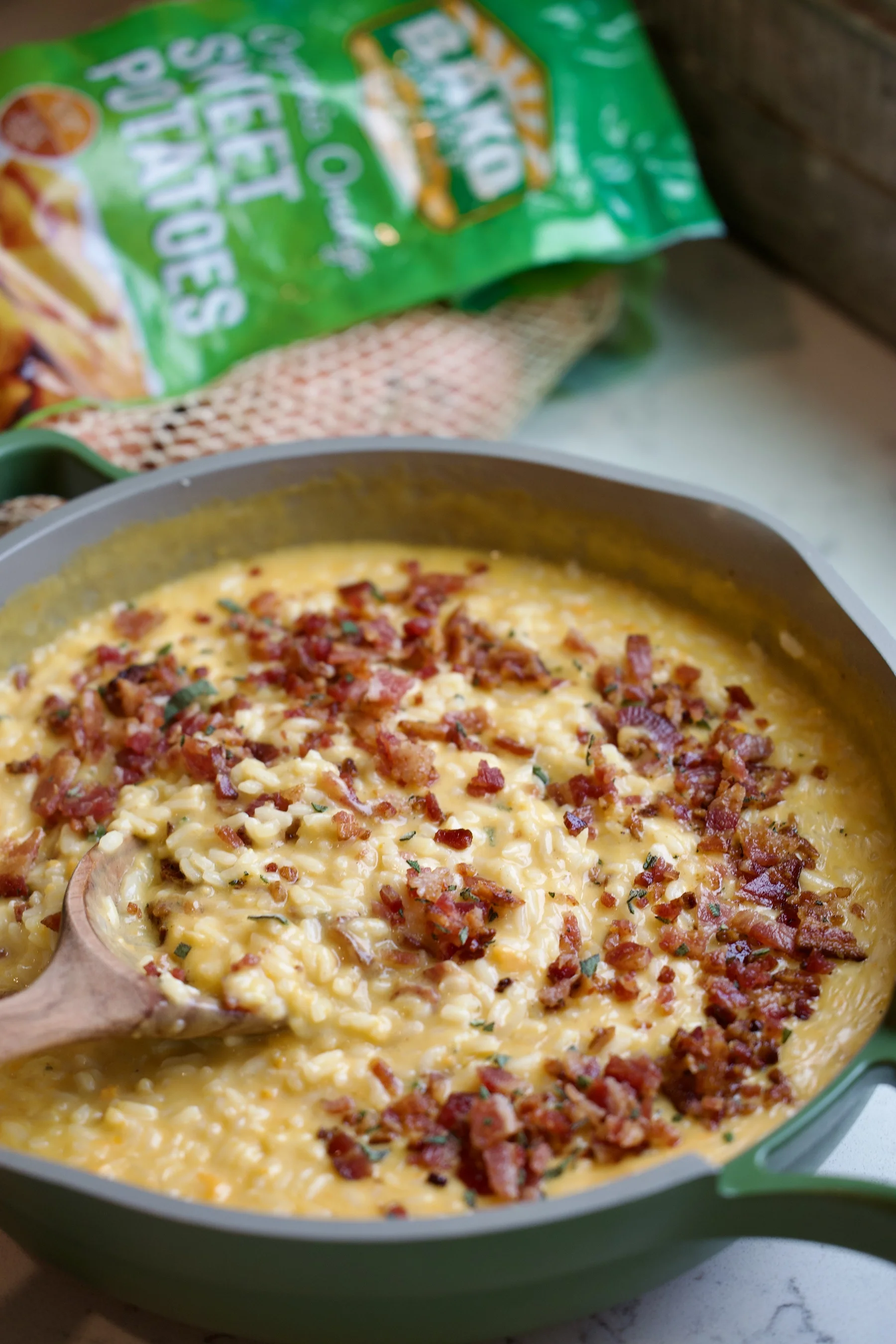 Bowl and spoon with sweet potato Risotto