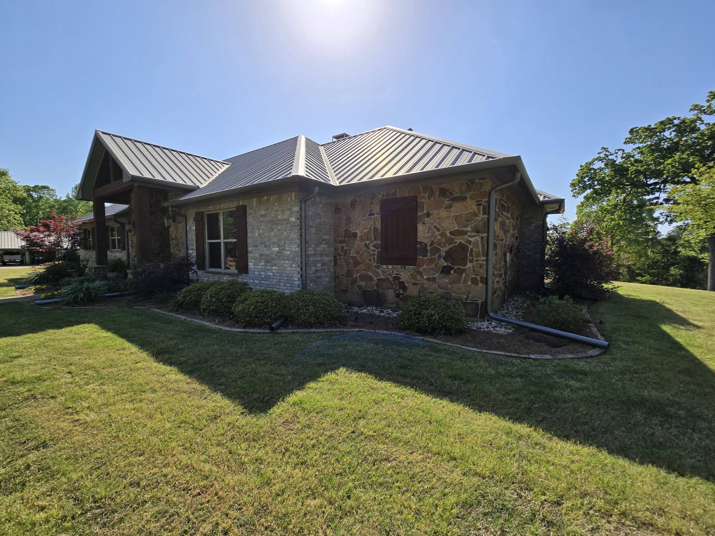 Straight Face Gutter with Round Spouts in Liberty City Texas