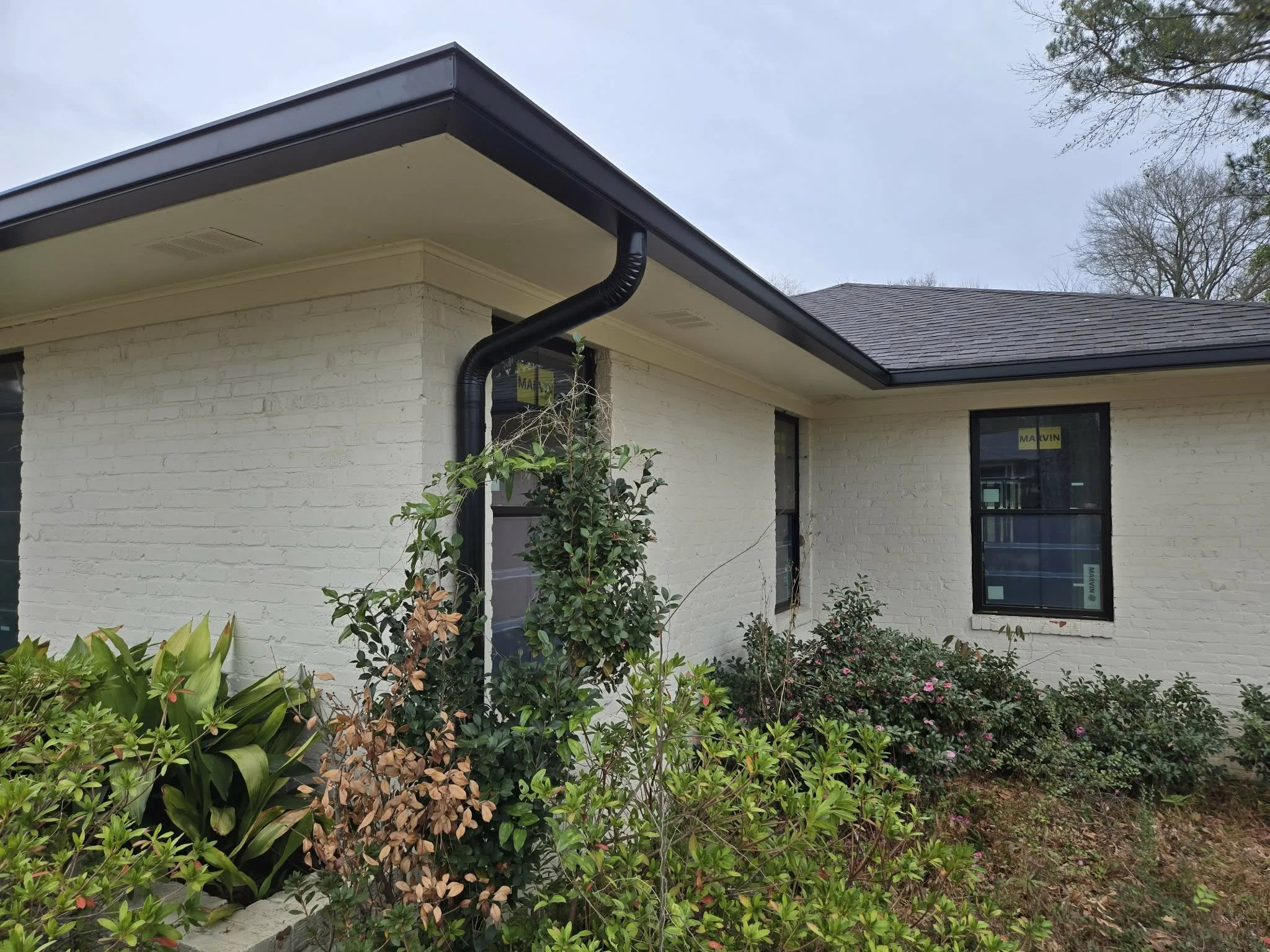Box Gutter with round downspouts in Longview Texas
