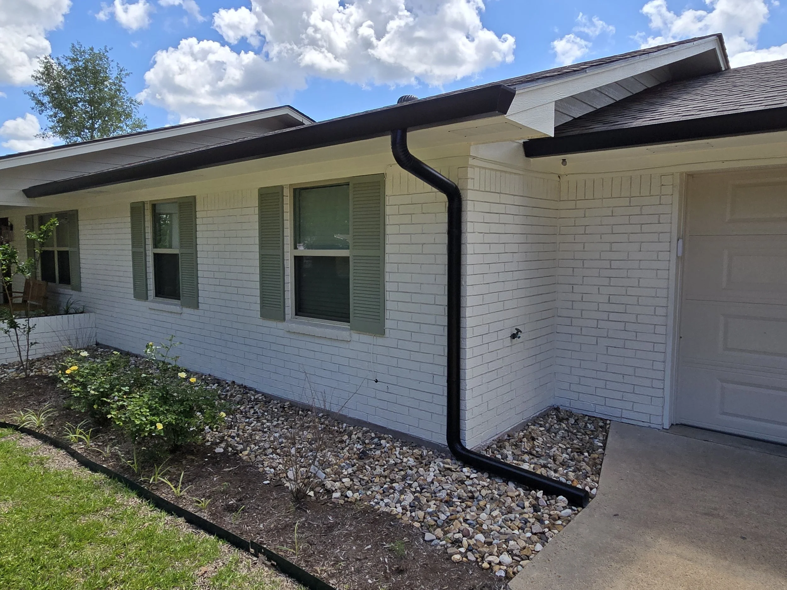 Straight Face Gutter with Round Spouts in Liberty City Texas