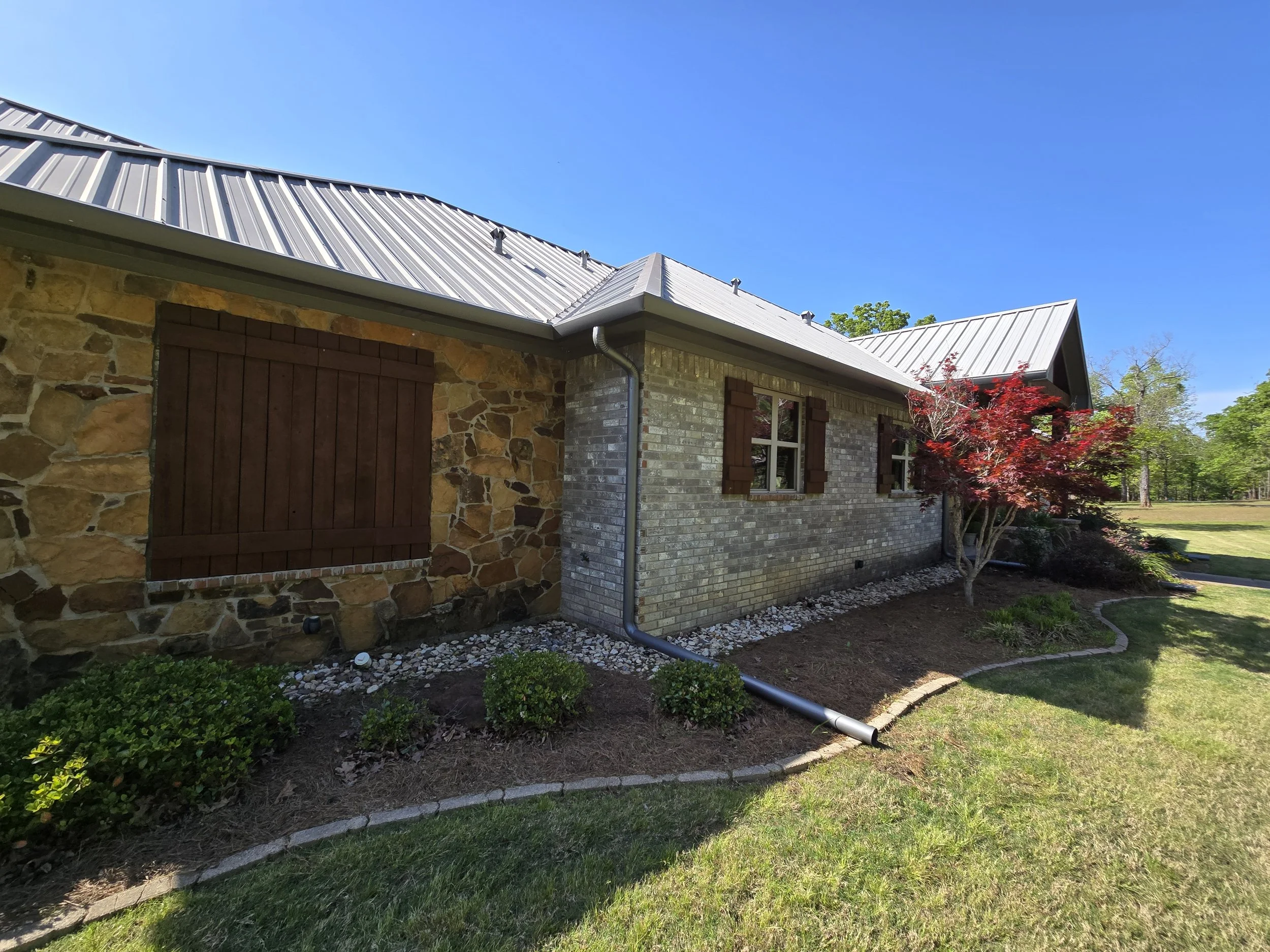 Straight Face Gutter with Round Spouts in Liberty City Texas