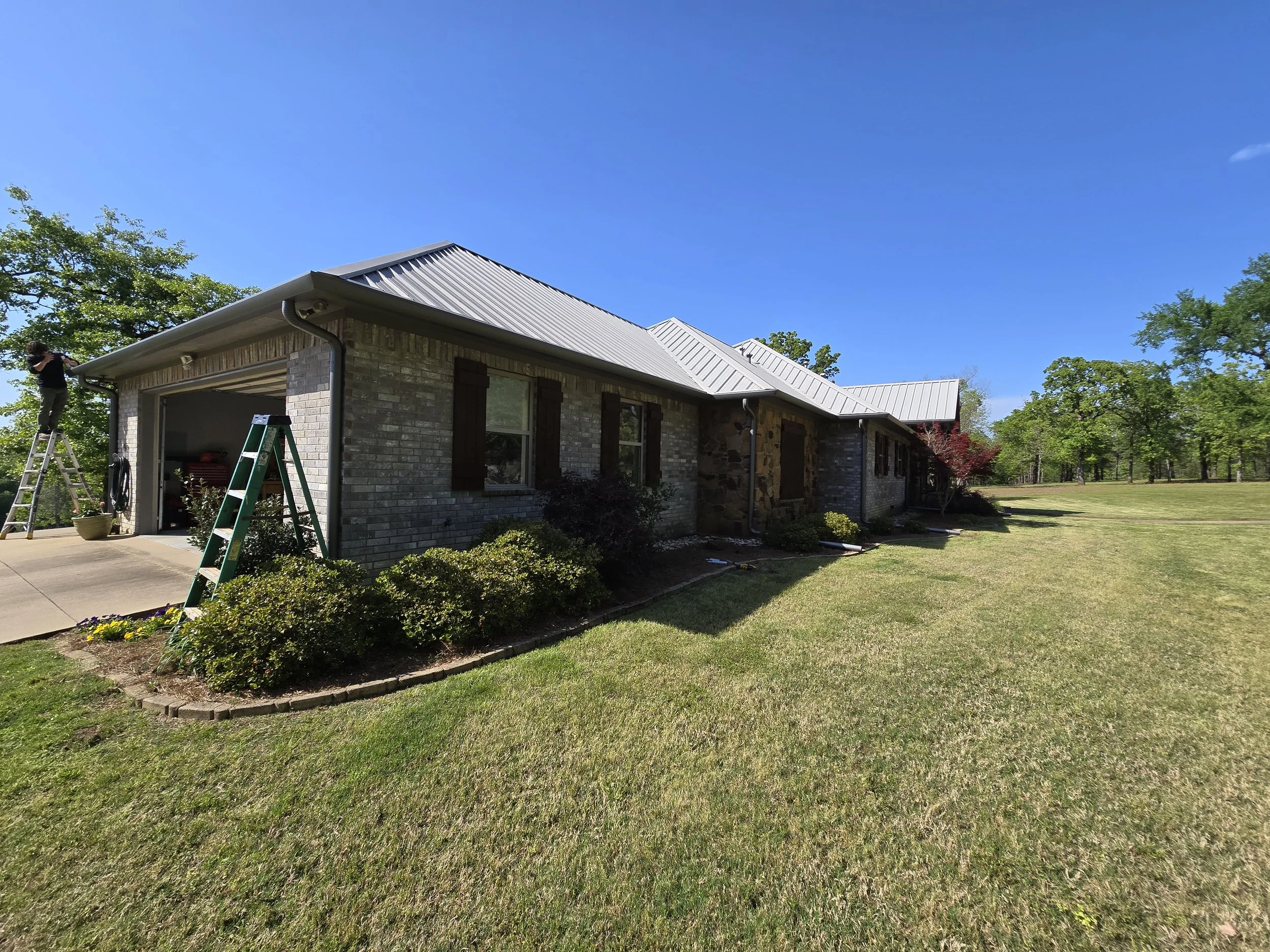 Straight Face Gutter with Round Spouts in Liberty City Texas