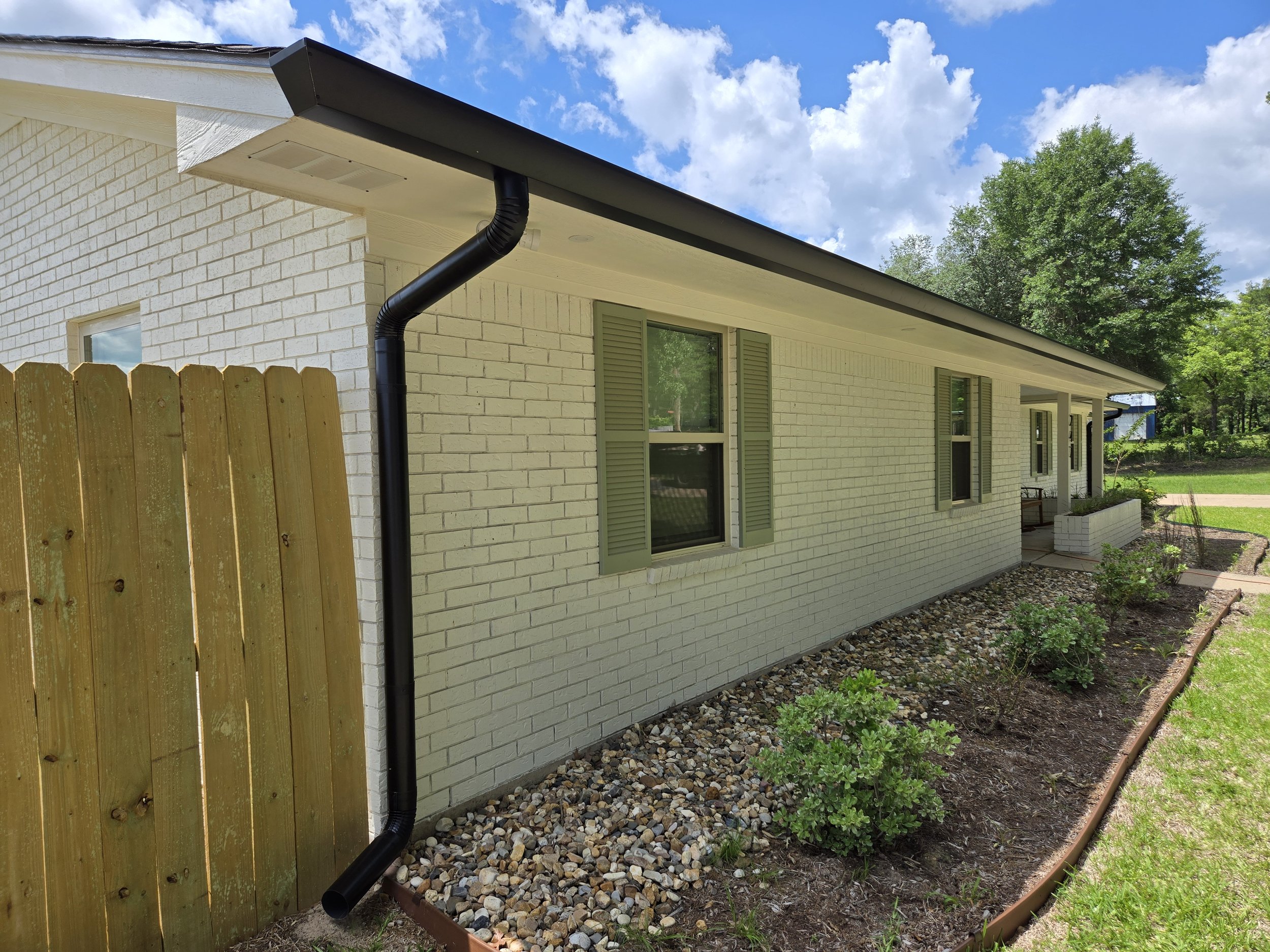Straight Face Gutter with Round Spouts in Liberty City Texas