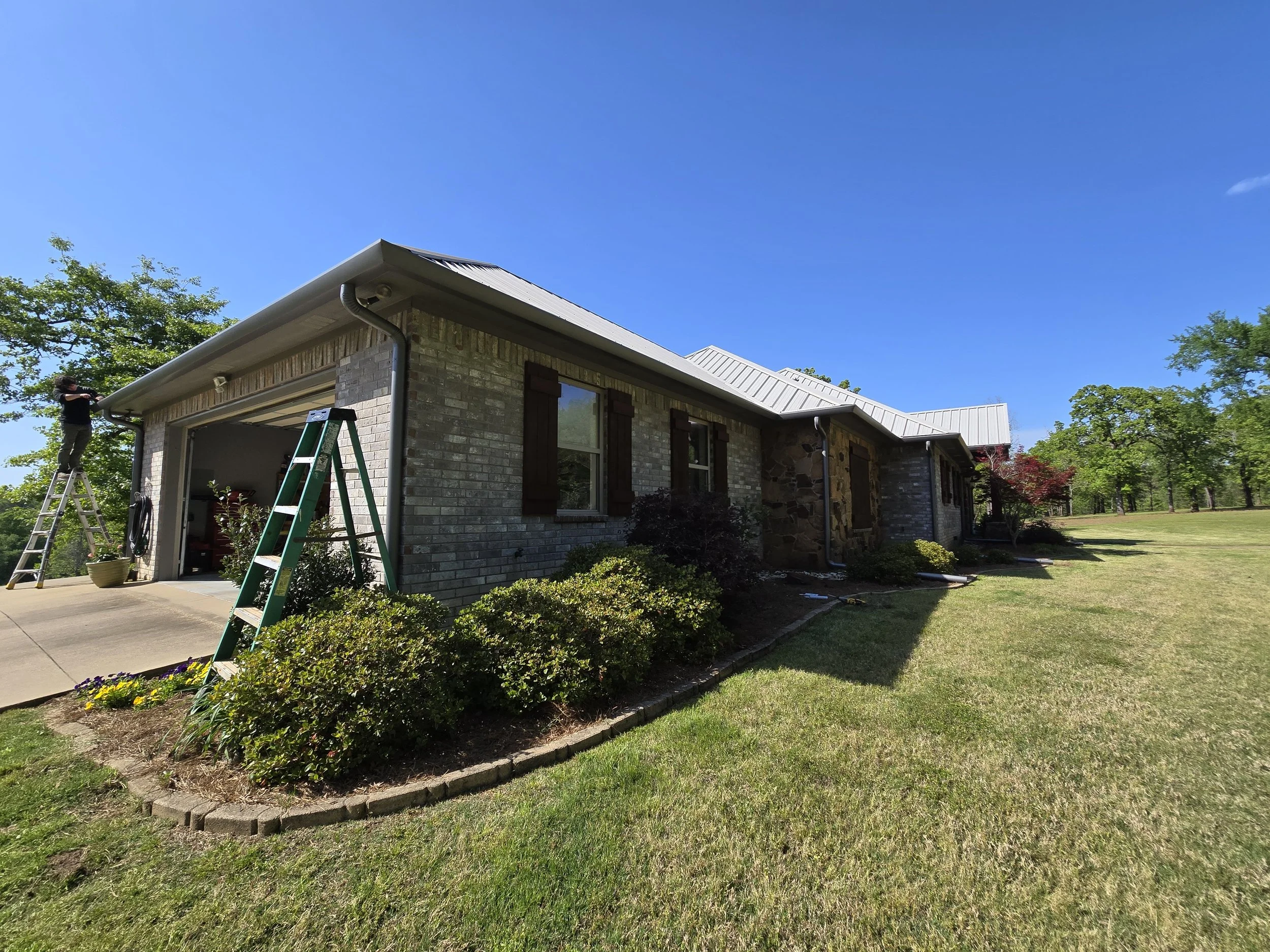 Straight Face Gutter with Round Spouts in Liberty City Texas
