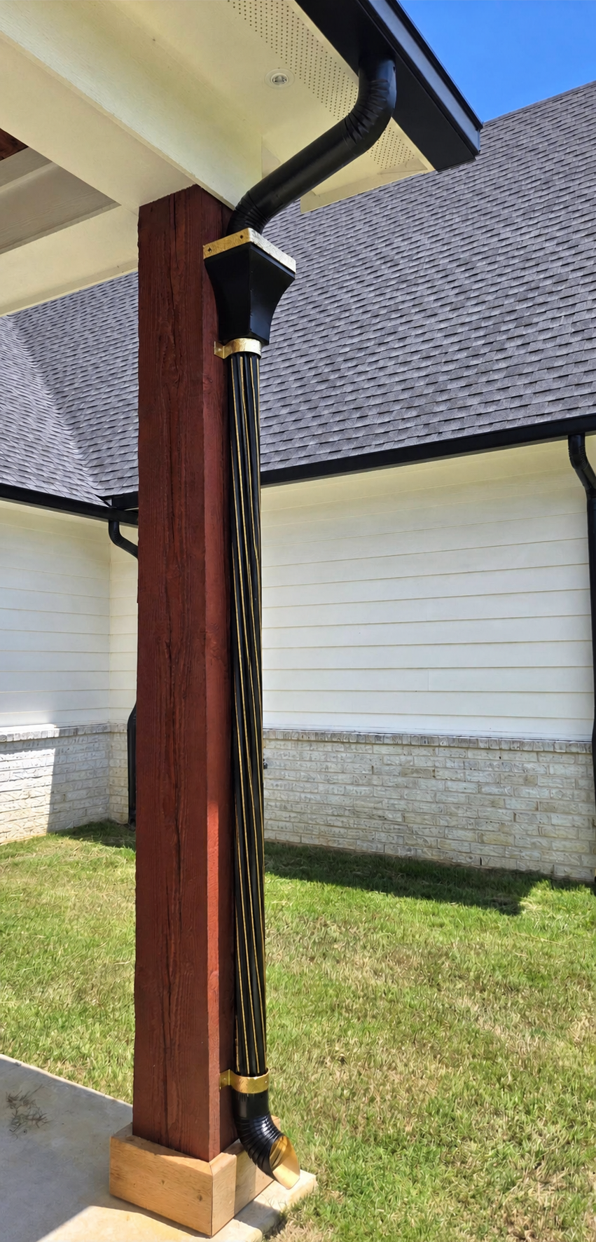 black and gold spiral downspout