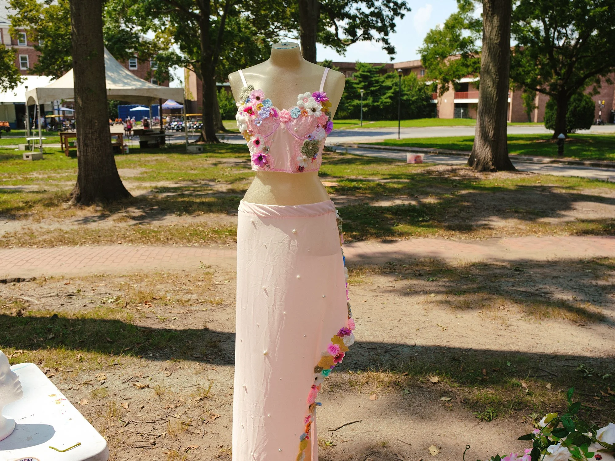 Youth fashion design of a pink skirt and shirt covered in flowers