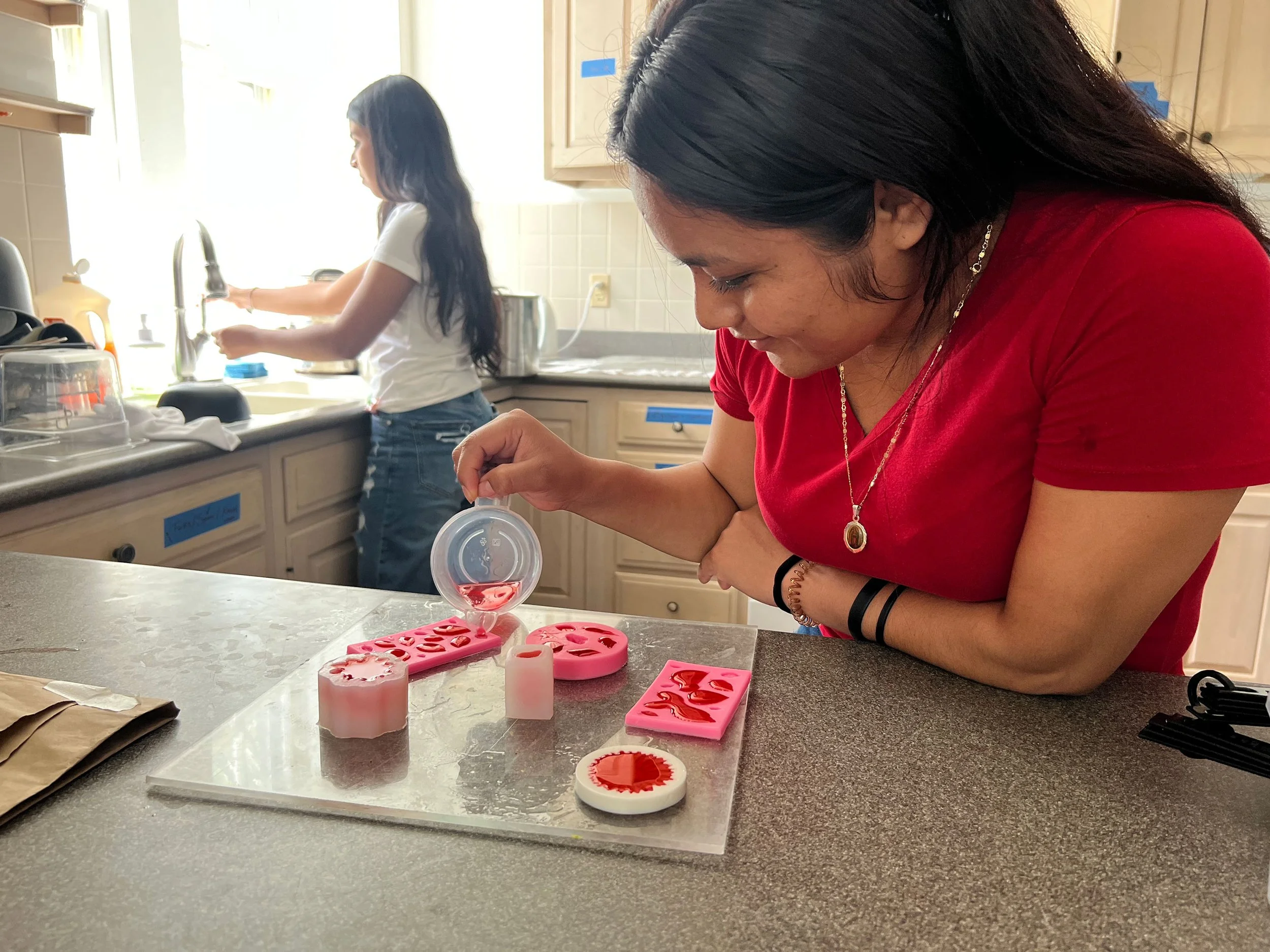 Young girl filling molds with food for a creative table setting