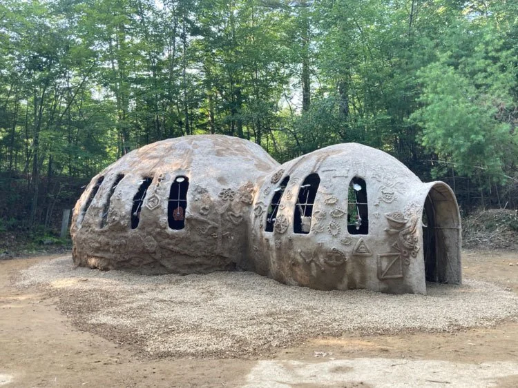 Domed building with illustrated icons on the sides