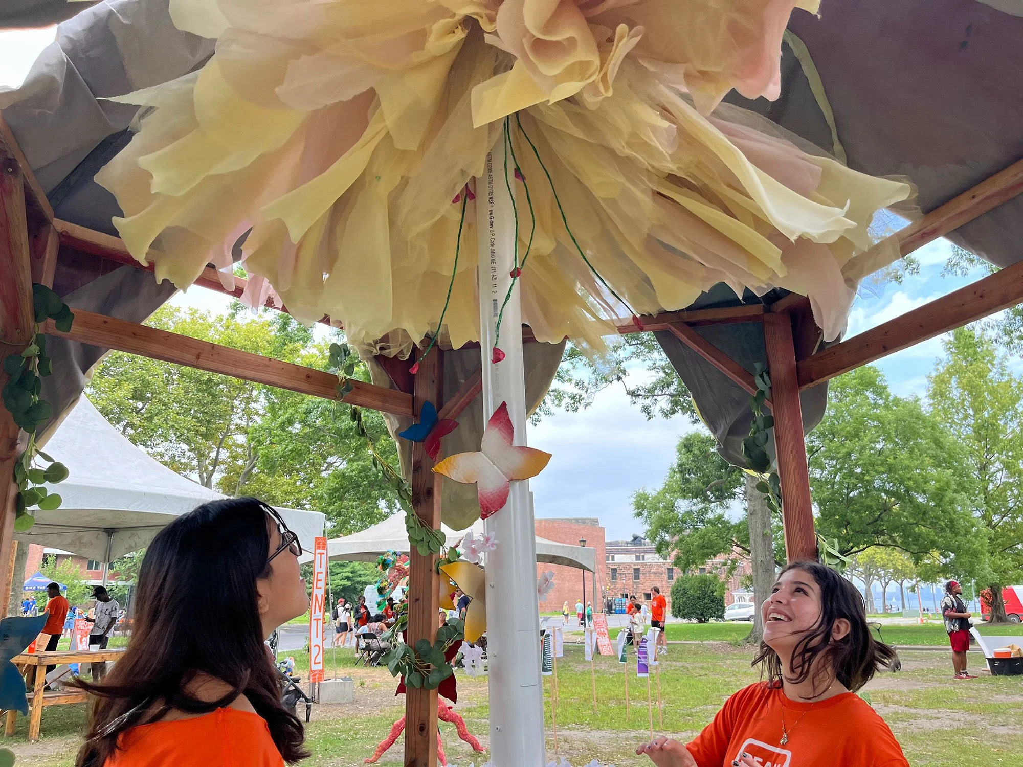 Students under Big Bloom at OtherWorlds Fair