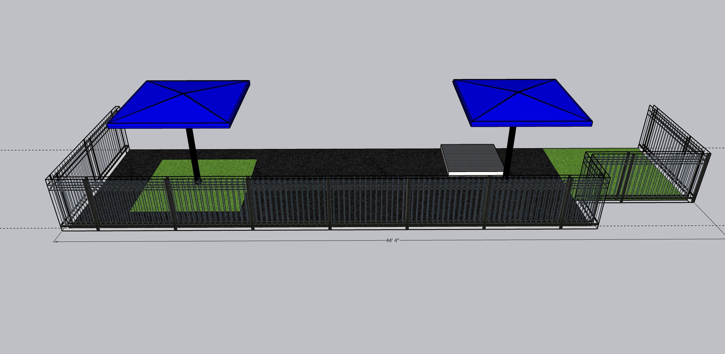 3D model of a fenced play area with two blue shade umbrellas, green artificial grass patches, and a black rubberized surface.