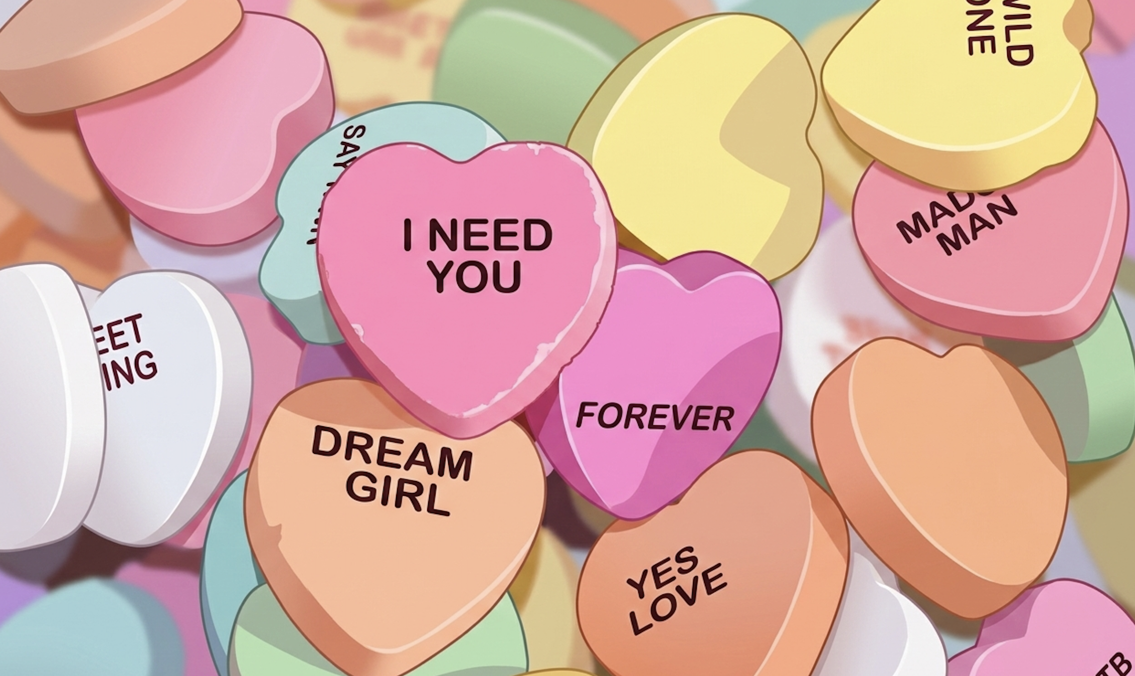 Bonbons en forme de cœurs avec des messages comme "I Need You" et "Forever" — illustration de la dépendance affective dans une relation toxique