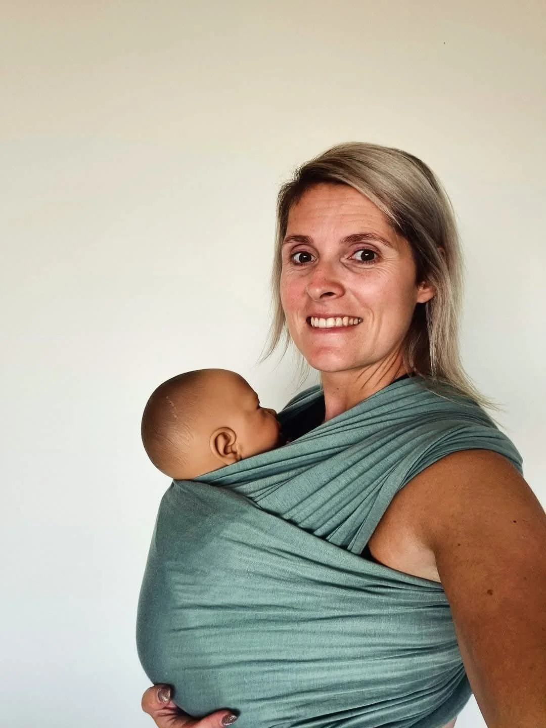 Instructievideo knopen van een rekbare draagdoek