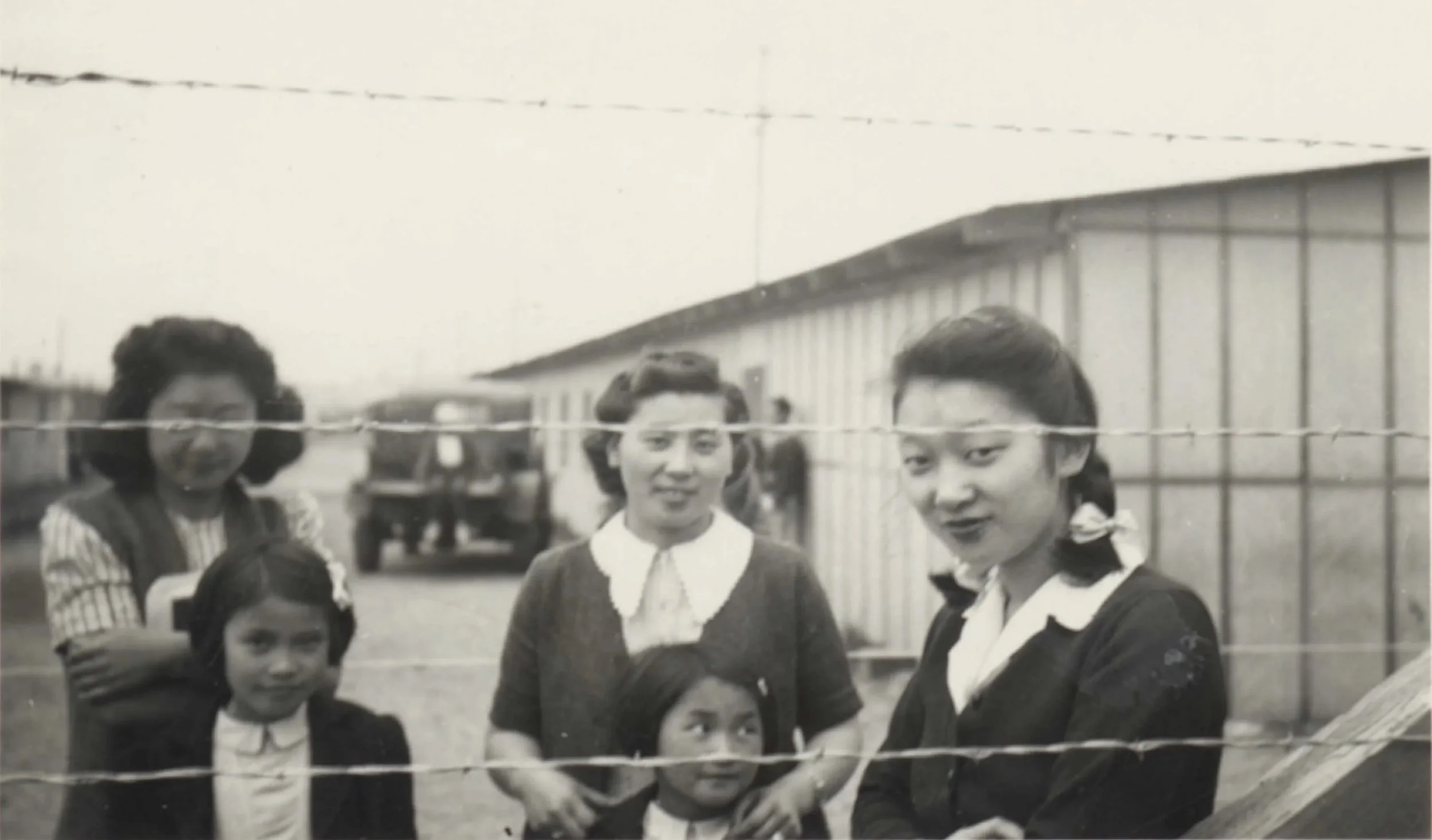 family behind barbed wire