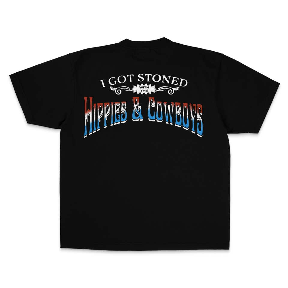 Hippies & Cowboys Got Stoned T-Shirt featuring distressed red, white, and blue Western lettering on the back, bold outlaw country band design, and classic black unisex cotton tee.