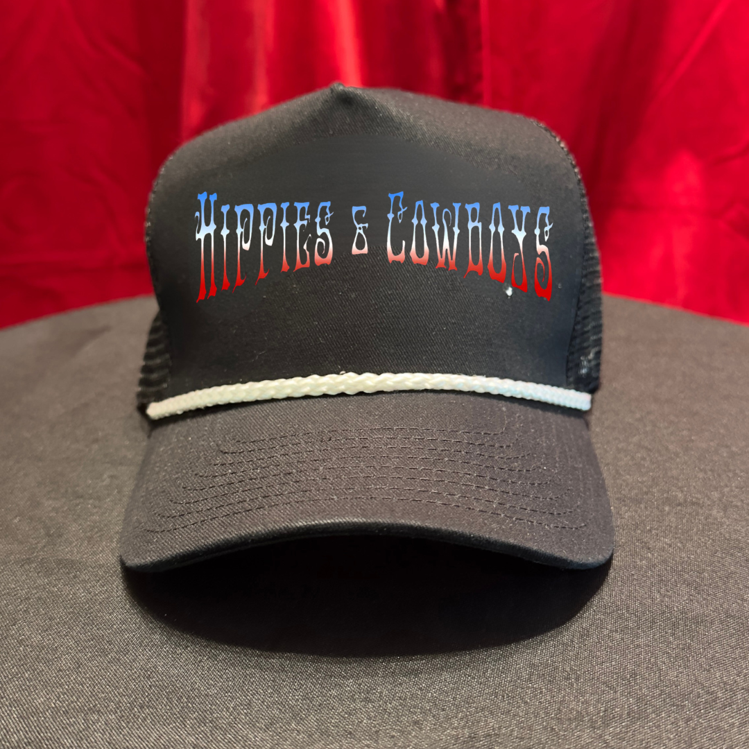 Black Hippies & Cowboys mesh trucker hat featuring a blue, white, and red gradient Western-style band logo, white rope accent, and curved brim. Nashville rock band merchandise.