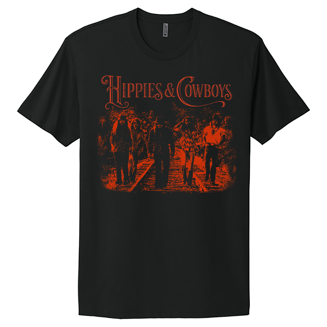 Black Hippies & Cowboys 2026 World Tour tee with orange vintage-style band graphic.