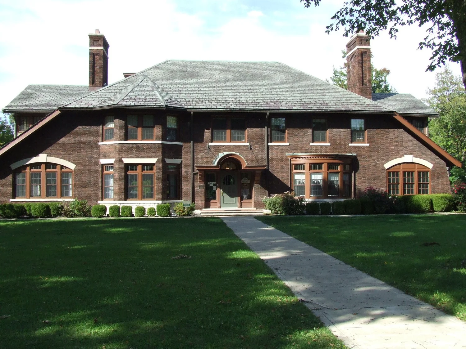 Henn Mansion at Sims Park in Euclid, with its brick facade and lawn, photographed in 2012