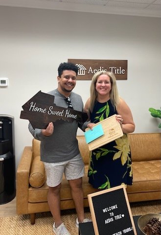 Lindsey Young with happy homeowners closing in Fairfax, VA!