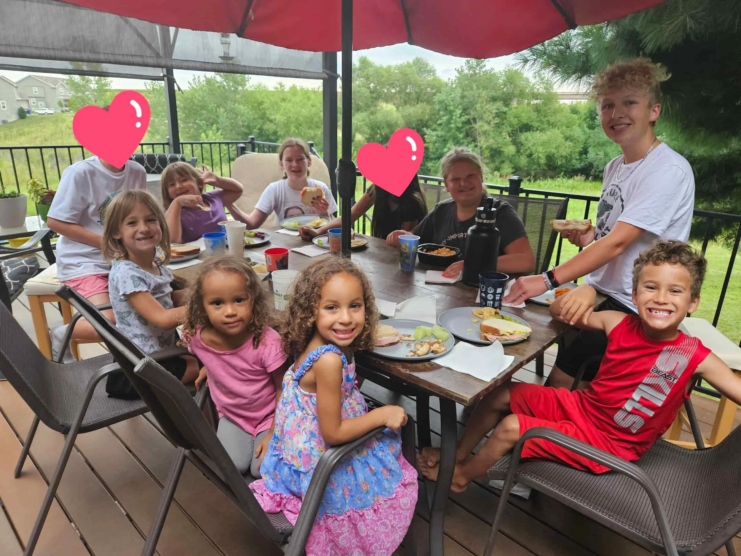 Friends gathered around a table sharing a meal together