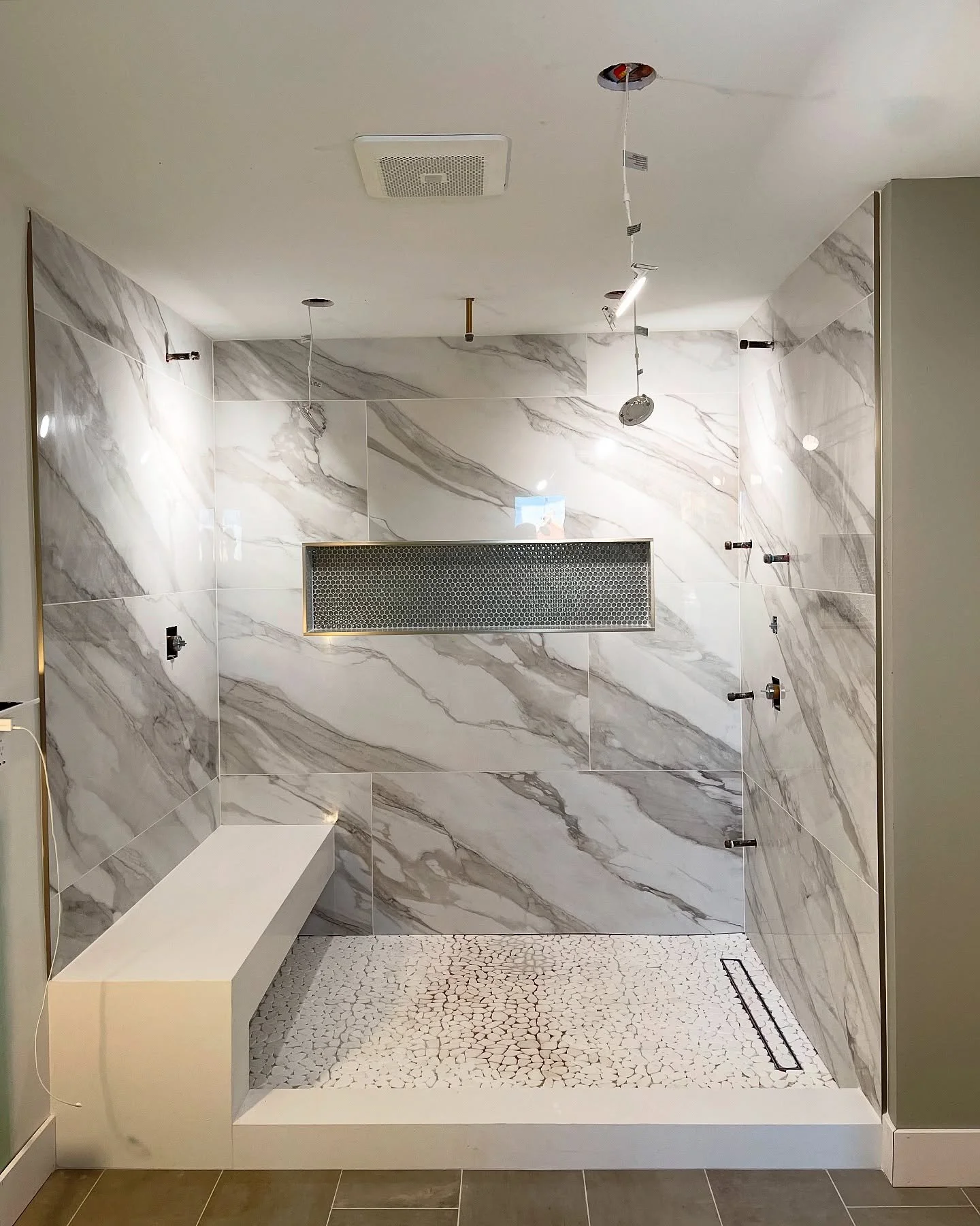 Start to finish tile work! 
24&rdquo; x 48&rdquo; Tiles 
Pebble Shower Floor + Linear Drain + Tile Insert
12&rdquo; x 24&rdquo; Main Floor

PSA:
Coffee was dropped on shower floor and forgot to take final pics after repair 🤷🏻&zwj;♂️

#damnelectrici