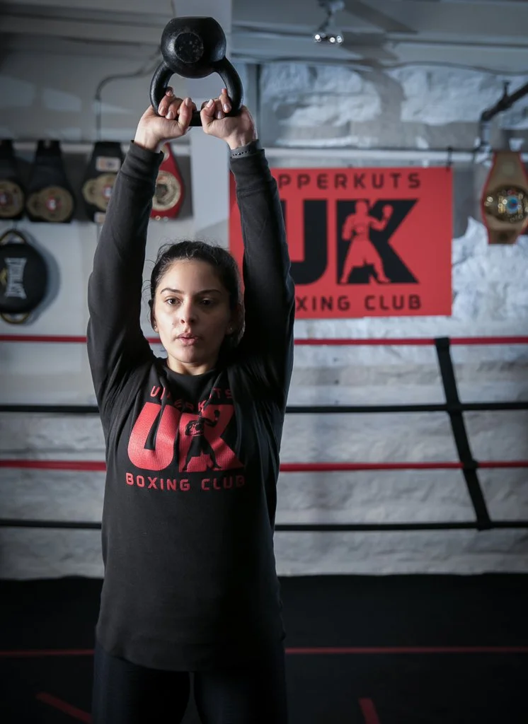 female exercising with weights