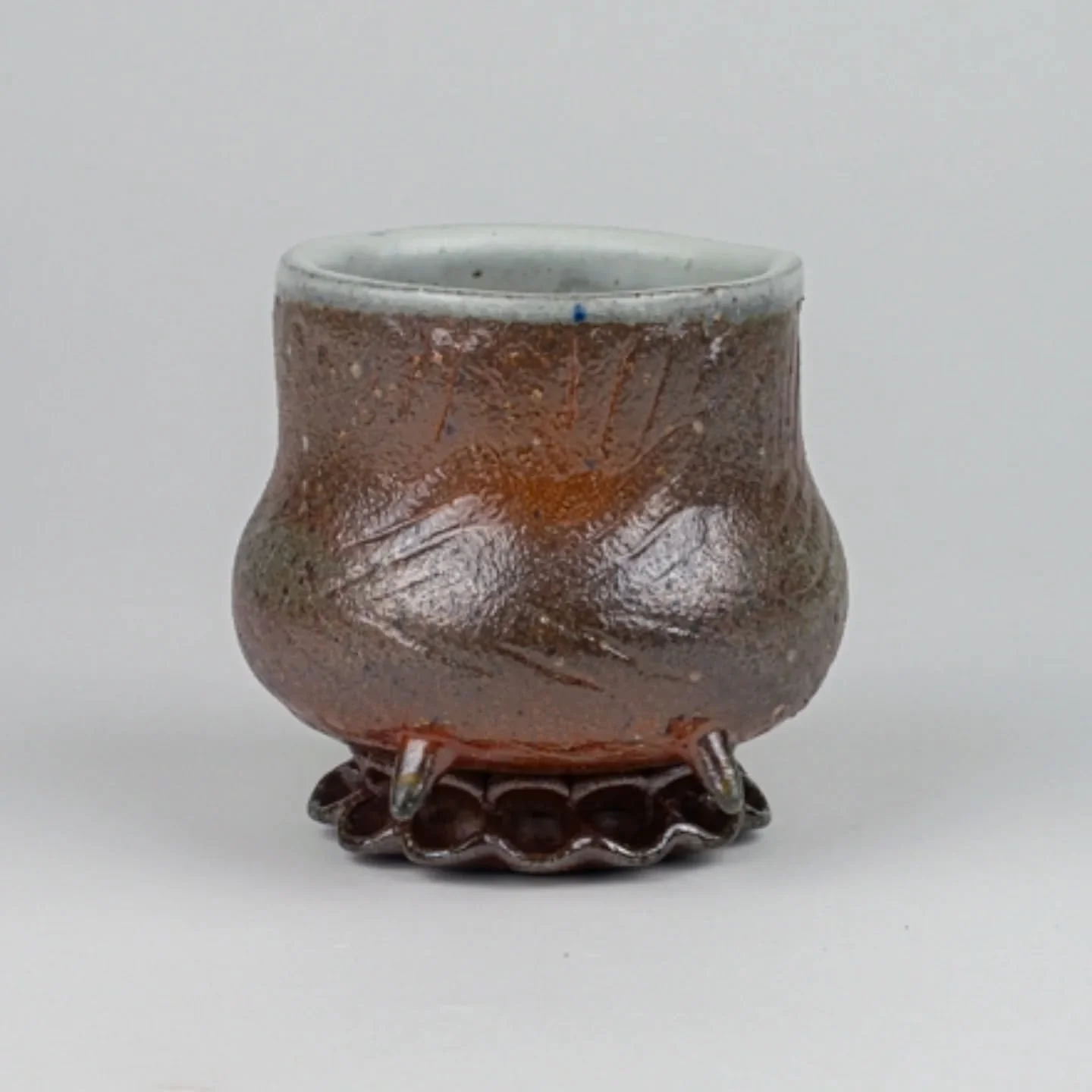 One of the cups I made and soda fired this summer while doing a ceramics residency @etsuartanddesign . I experimented with making a texture paddle for this one.