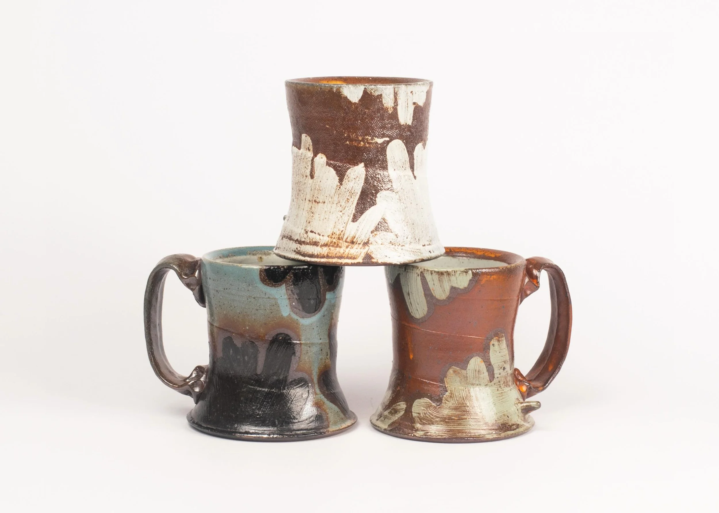 Here&rsquo;s a little group shot of some of my favorite cups from my recent firing.

I spent the last few months preparing work to fill the soda kiln. Having learned so much from the last firing, I was excited to continue to explore and experiment wi