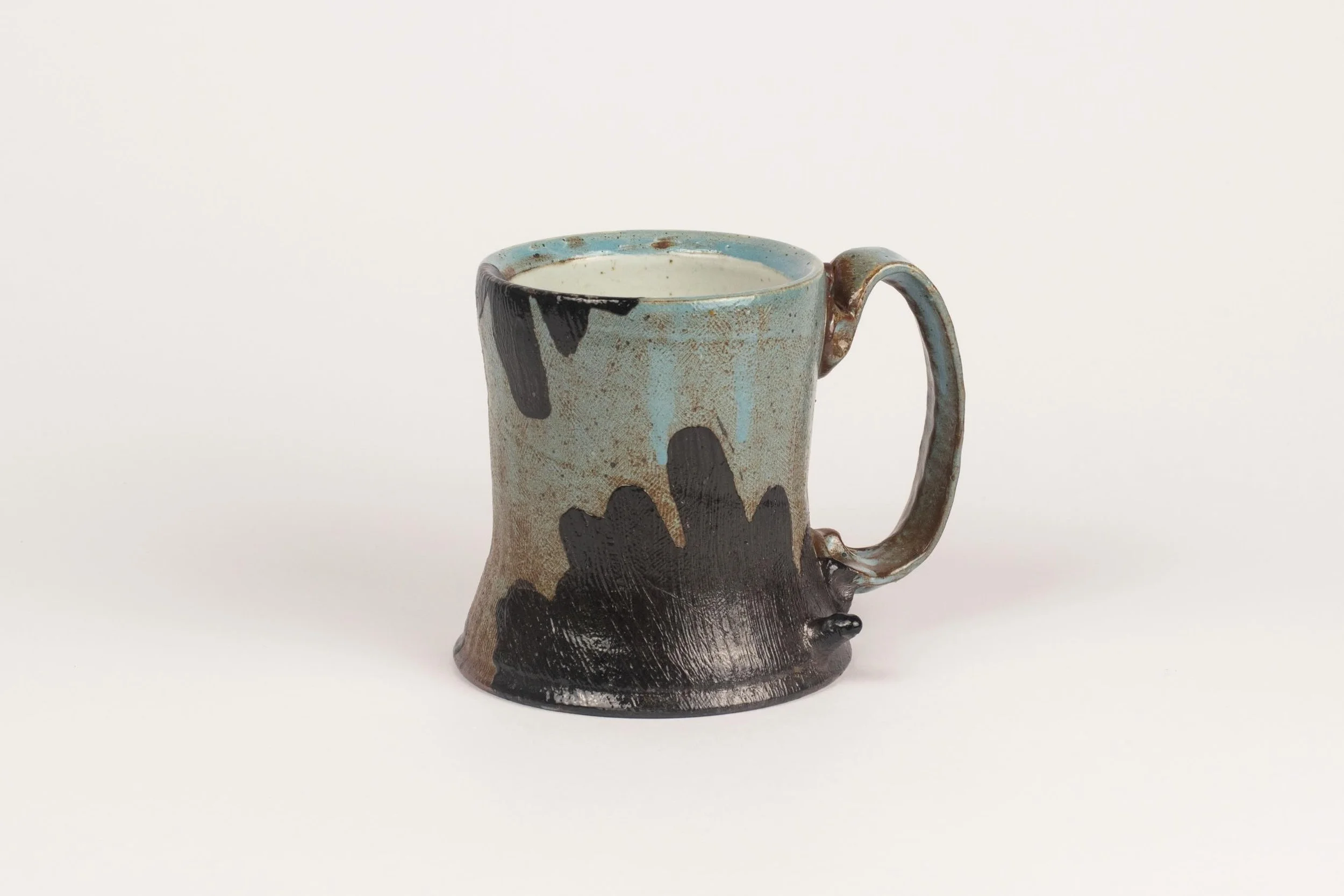 I made a ton of cups for this firing and really loved how this blue slip came out. Sometimes you just gotta trust your gut even then the test tiles are underwhelming.