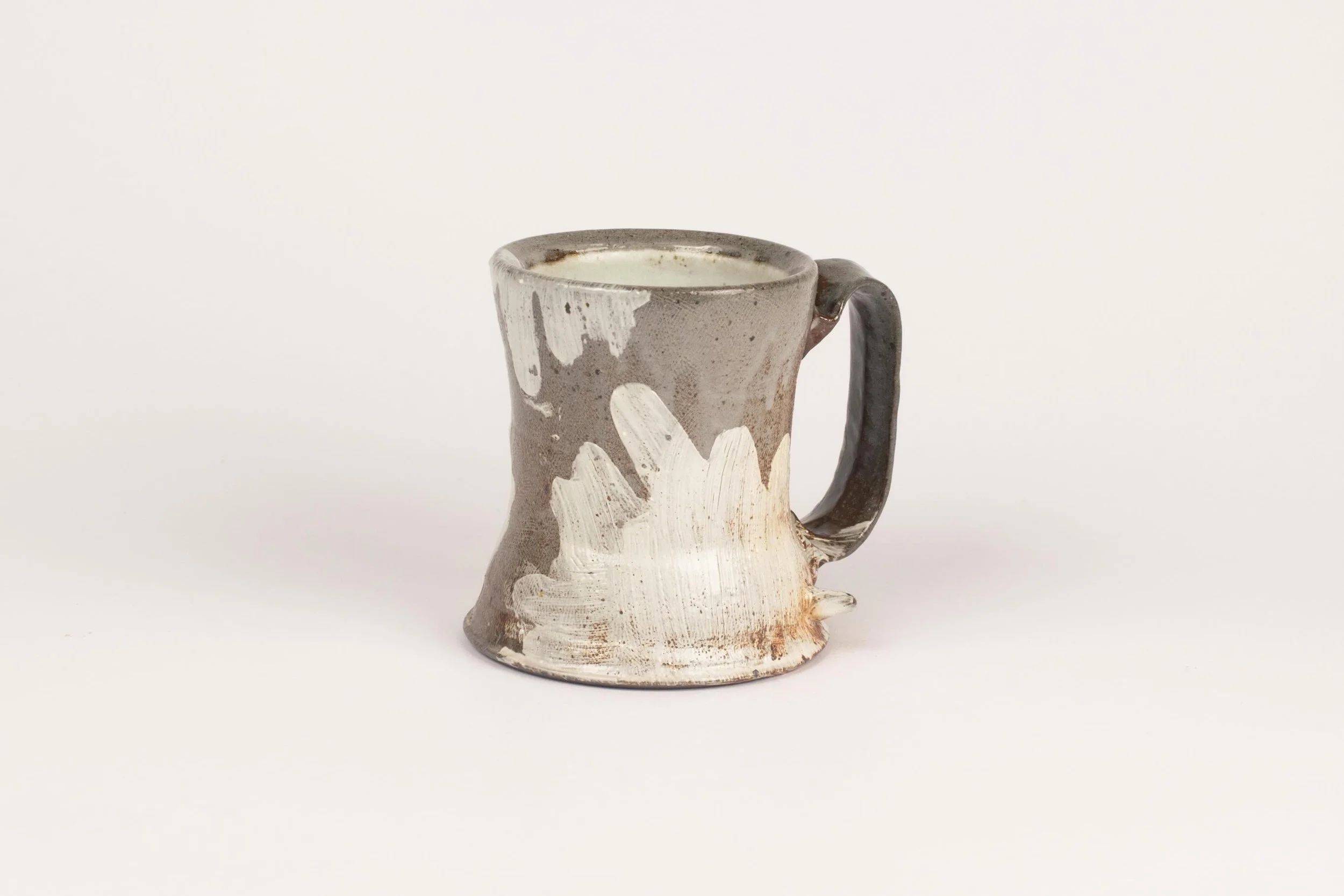 This cup was likely located in front of one of the spy ports we spray the soda mixture through. I just love how each piece in a soda firing has its own lovely variations. While preparing for the next firing, I&rsquo;m thinking about the surfaces of t