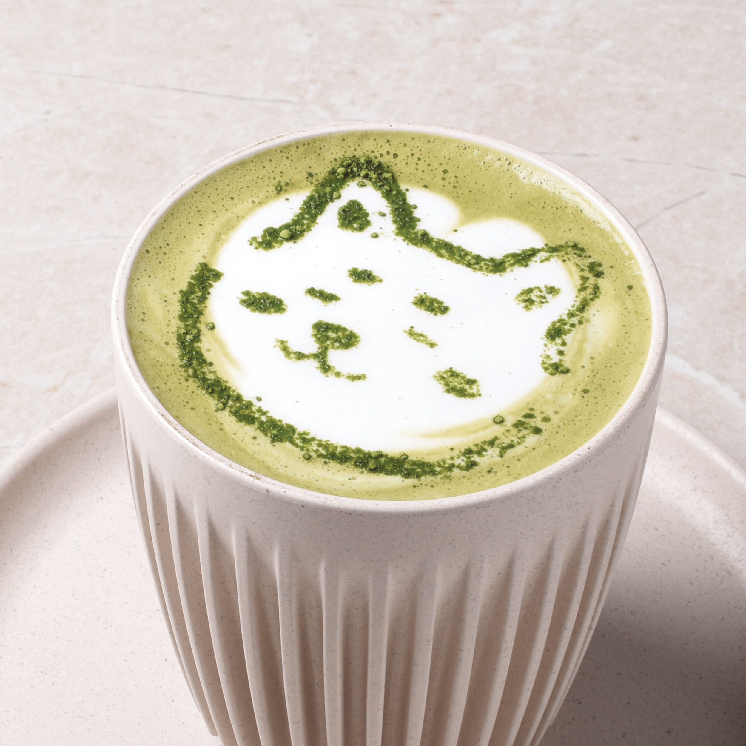 Hot coffee matcha latte combining matcha and espresso with steamed milk